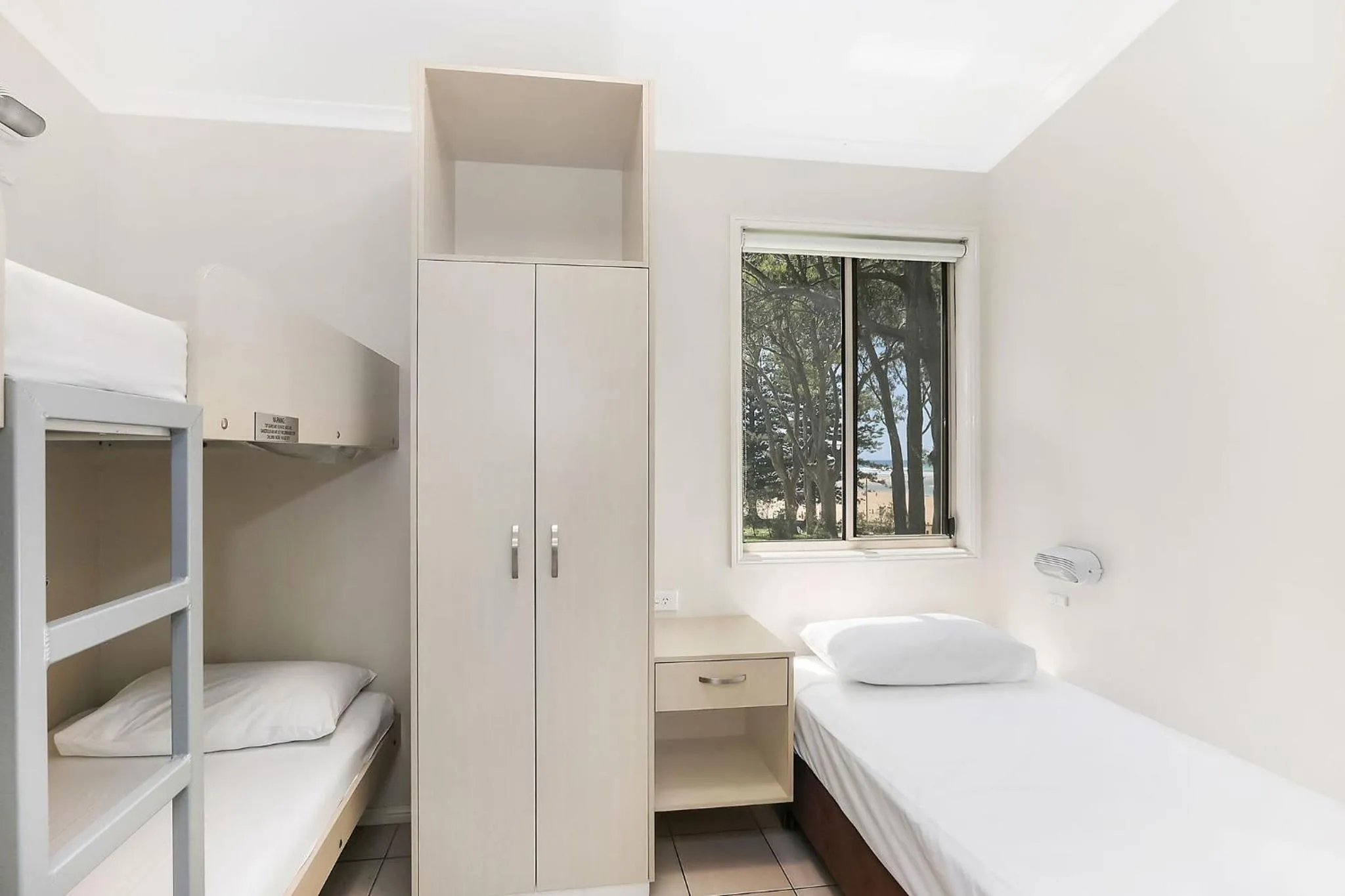 Bed in Reflections Moonee Beach - Holiday Park