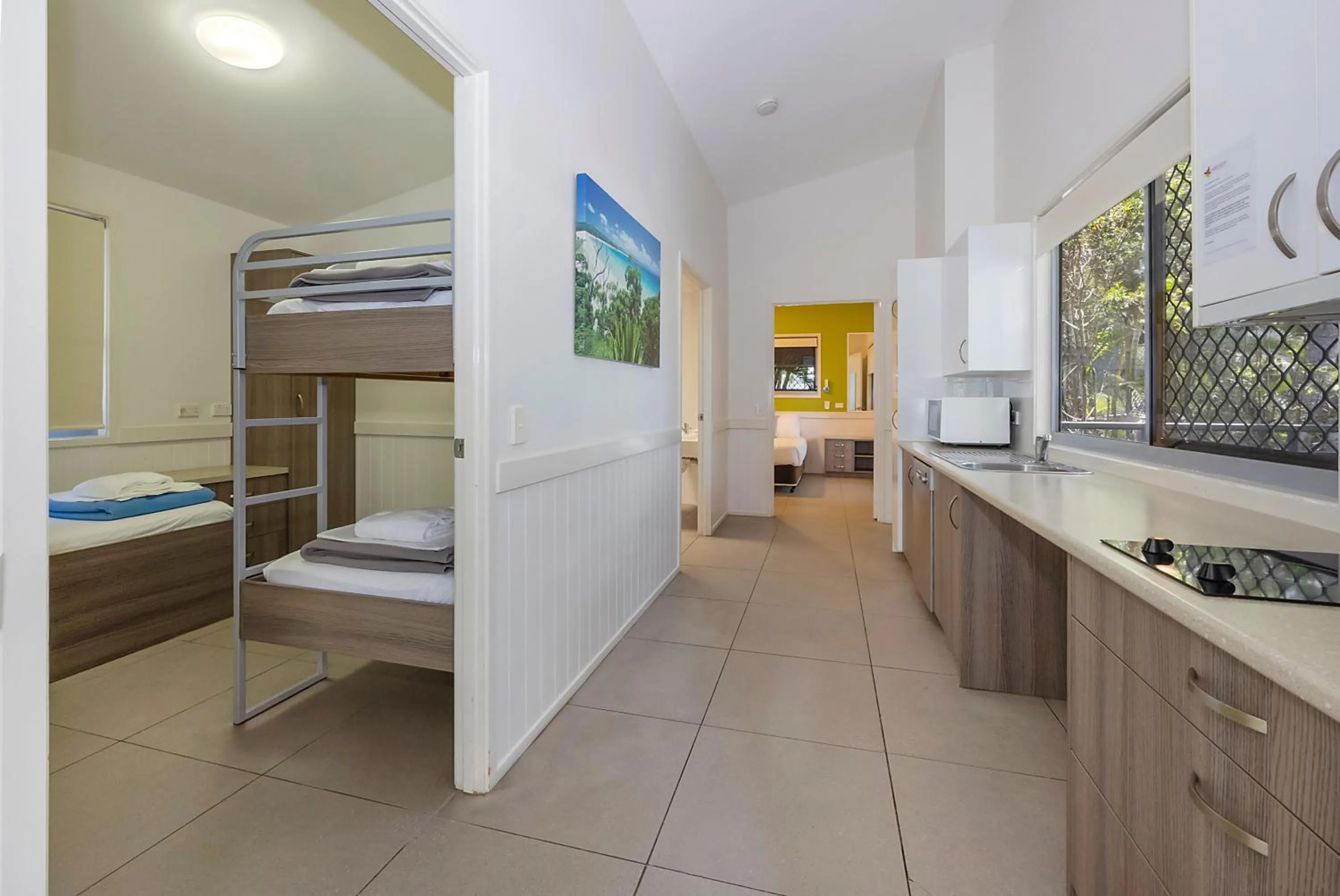 kitchen, Bed in Reflections Byron Bay - Holiday Park