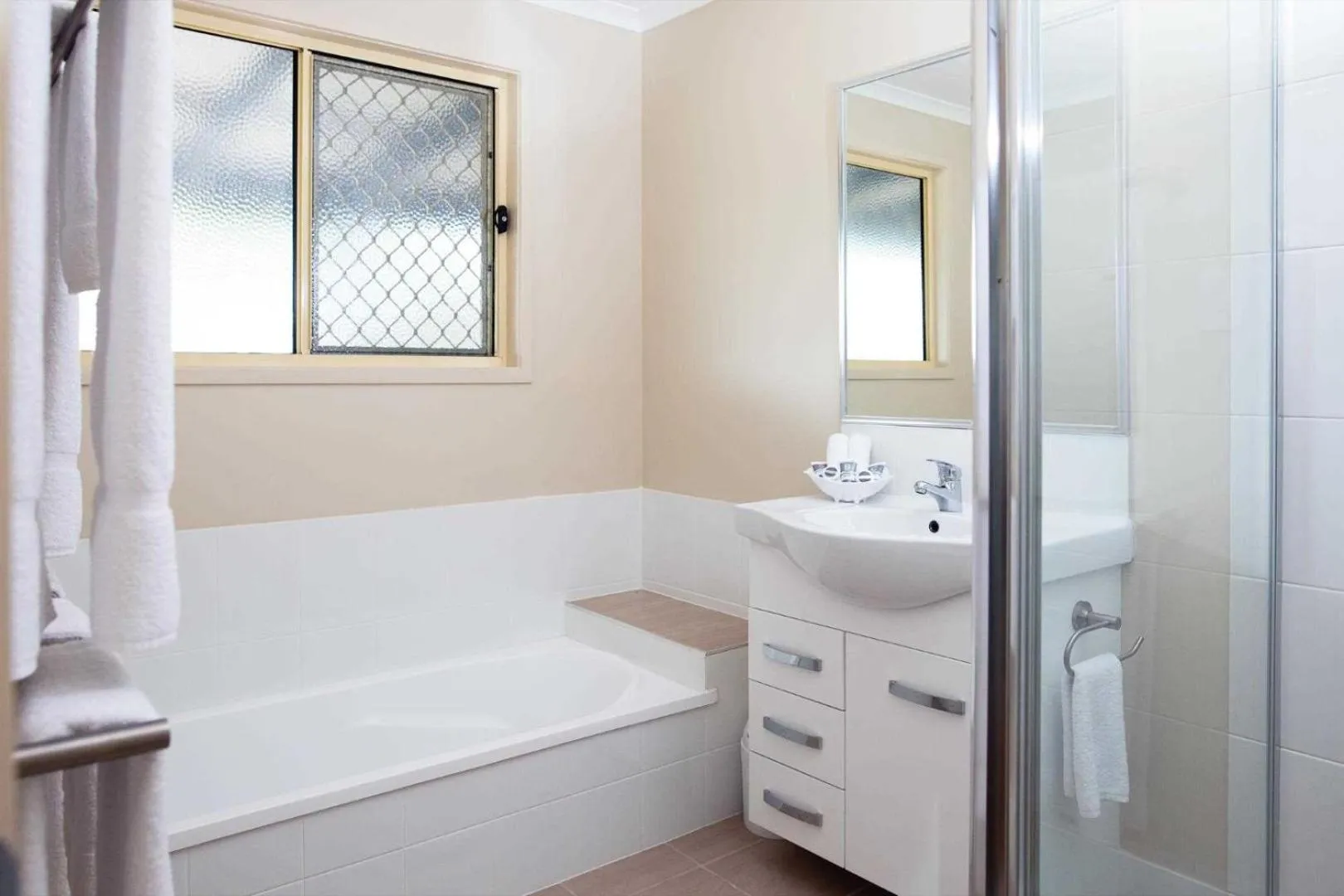 Bathroom, Bed in Reflections Lennox Head - Holiday Park