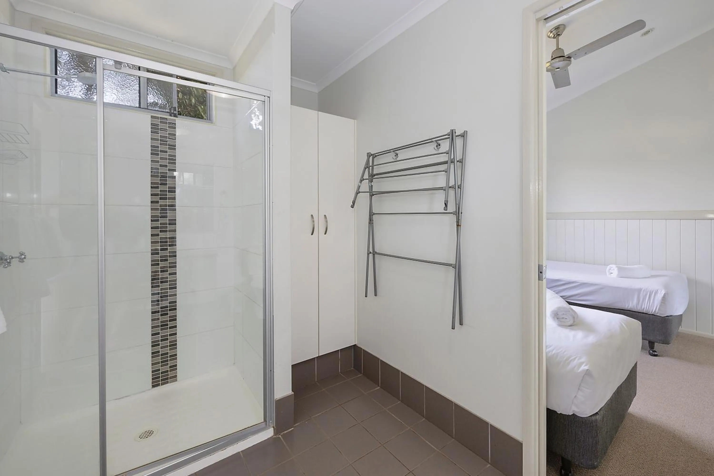 Bathroom, Bed in Reflections Lennox Head - Holiday Park