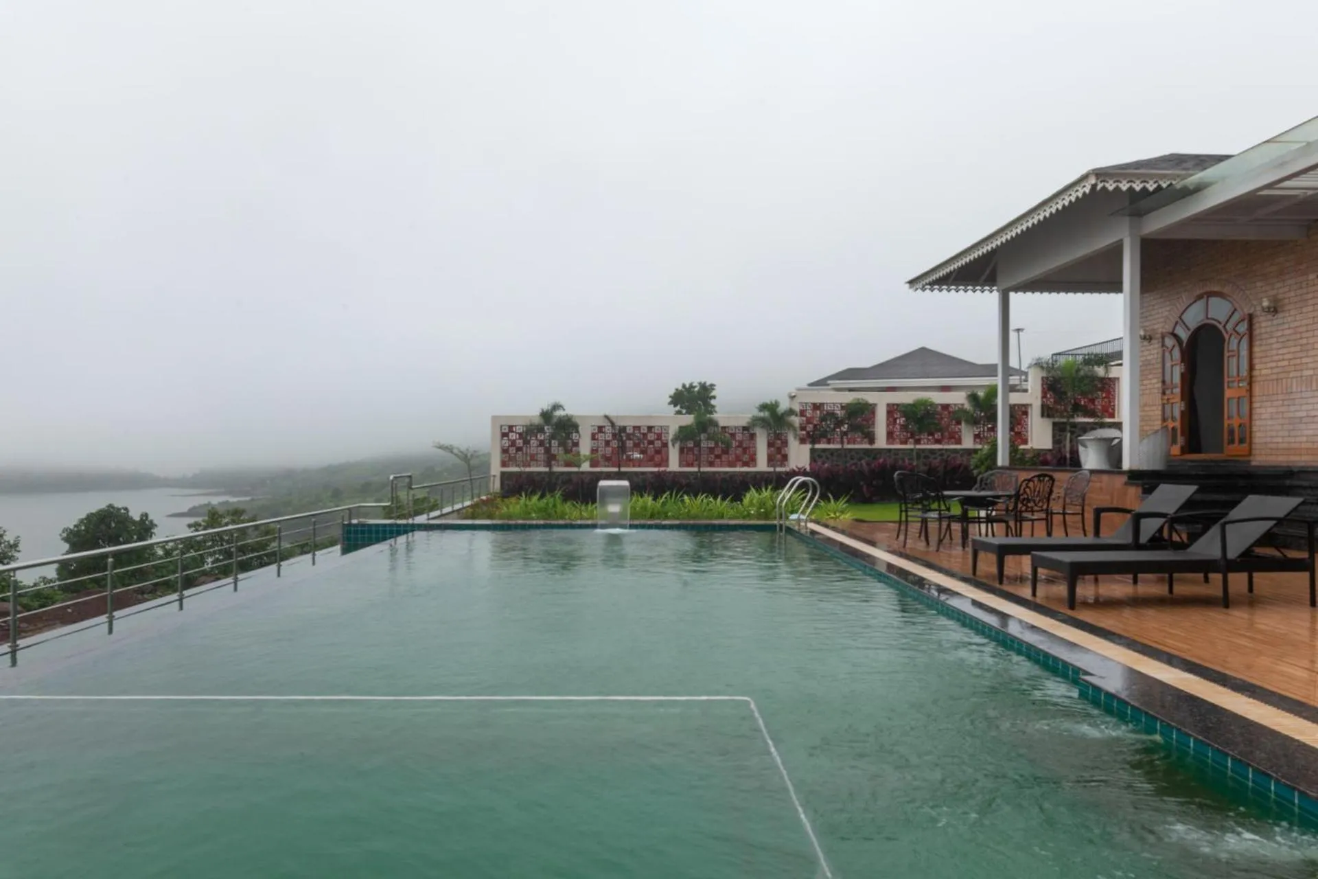 Swimming pool in Lake Arches by StayVista - Lakeside villa with Infinity pool, Gazebo & Modern Greek interiors