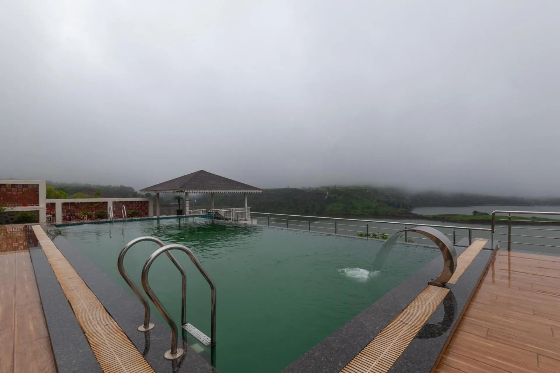 Swimming pool in Lake Arches by StayVista - Lakeside villa with Infinity pool, Gazebo & Modern Greek interiors