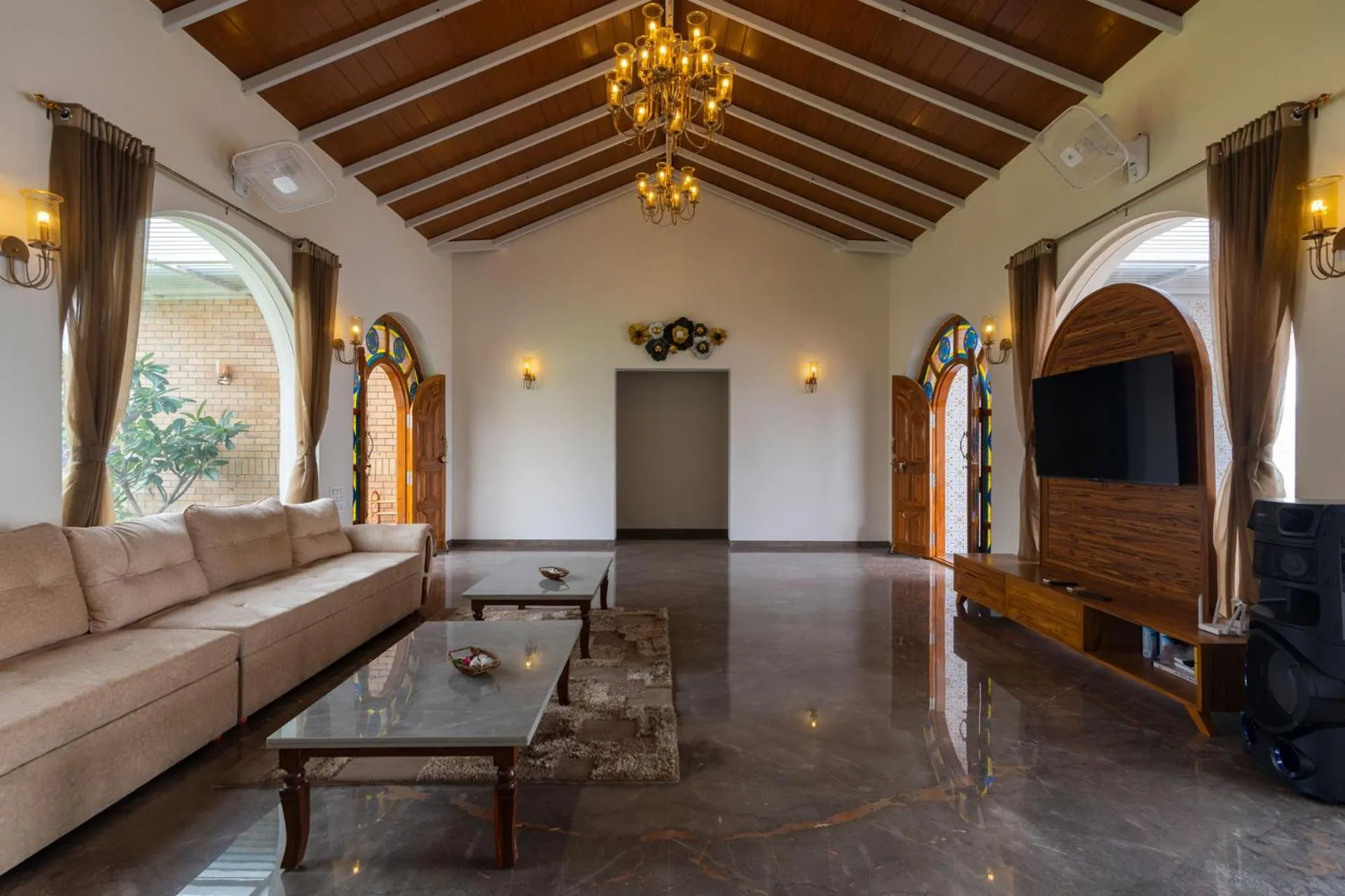 Living room in Lake Arches by StayVista - Lakeside villa with Infinity pool, Gazebo & Modern Greek interiors