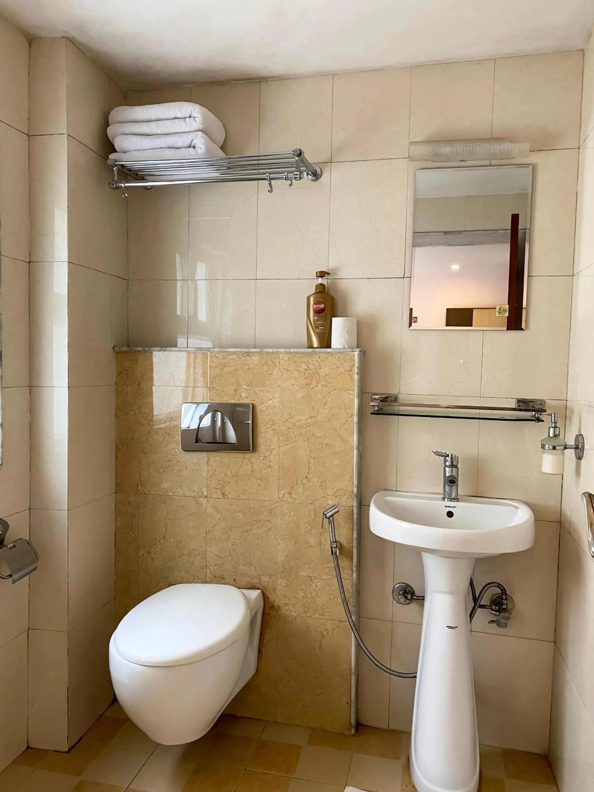 Toilet in Lemon Tree Hotel Pvt. Ltd