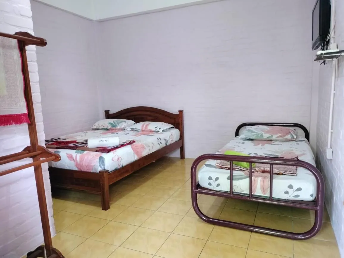 Bed in KAMILA MOTEL TELUK SENANGIN
