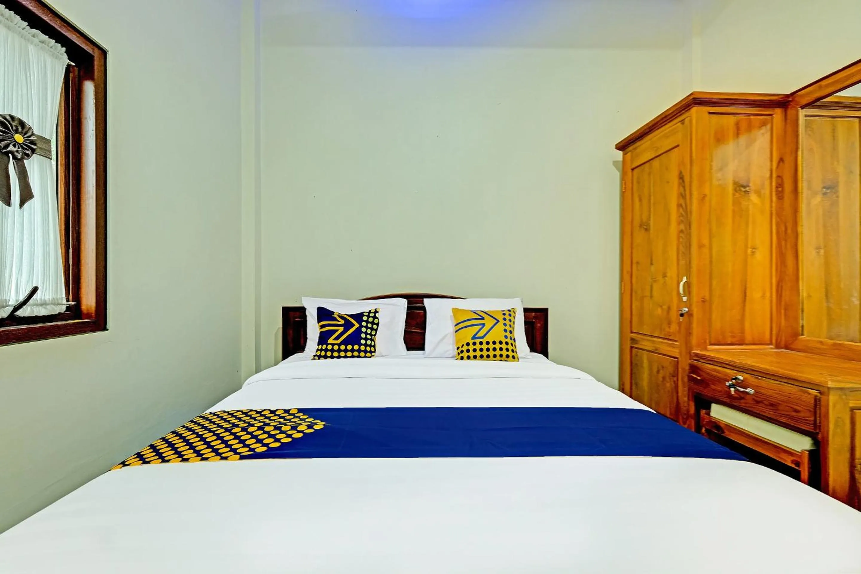 Bedroom in OYO Homes 91095 Desa Wisata Conto