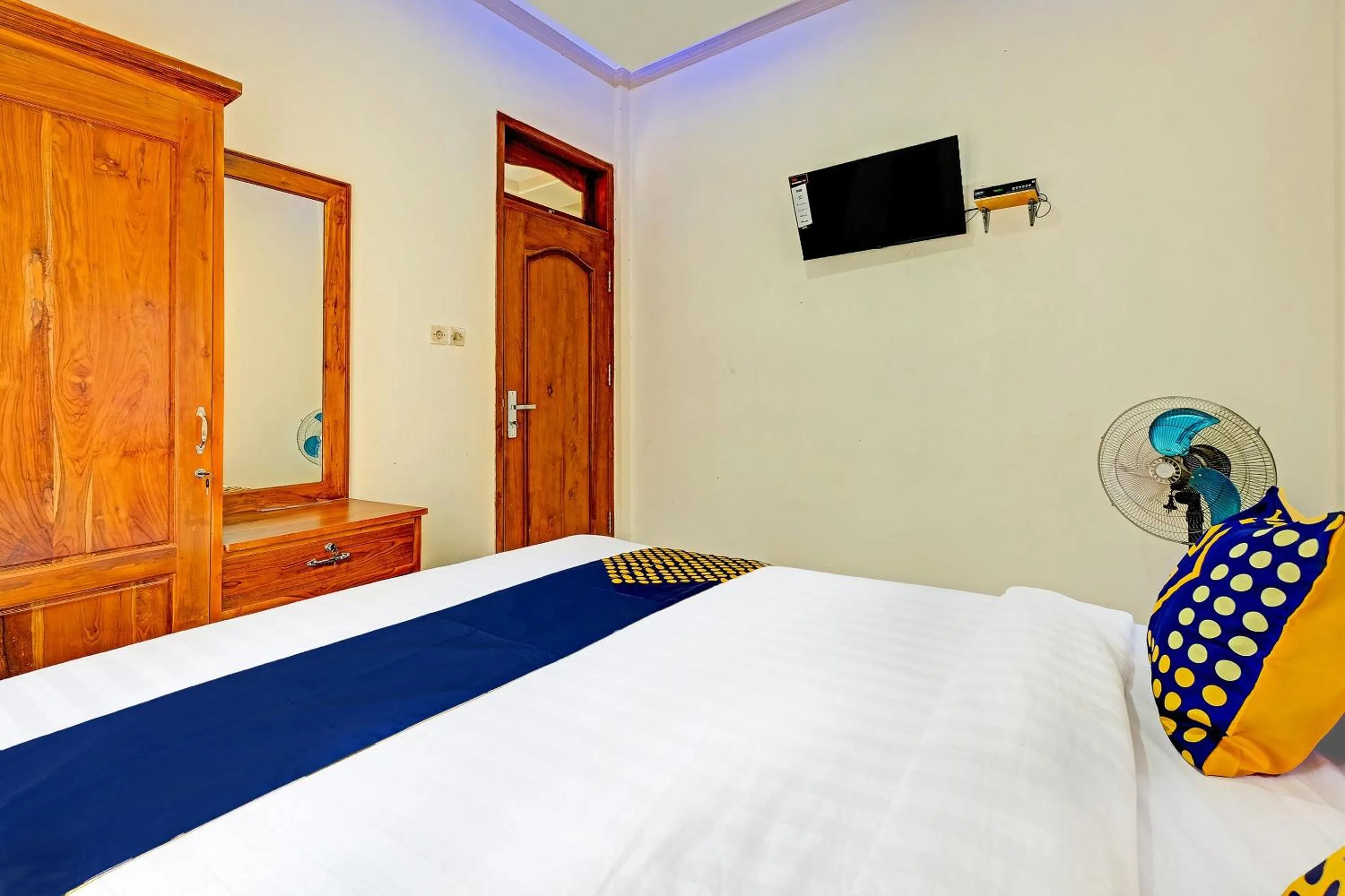 Bedroom in OYO Homes 91095 Desa Wisata Conto