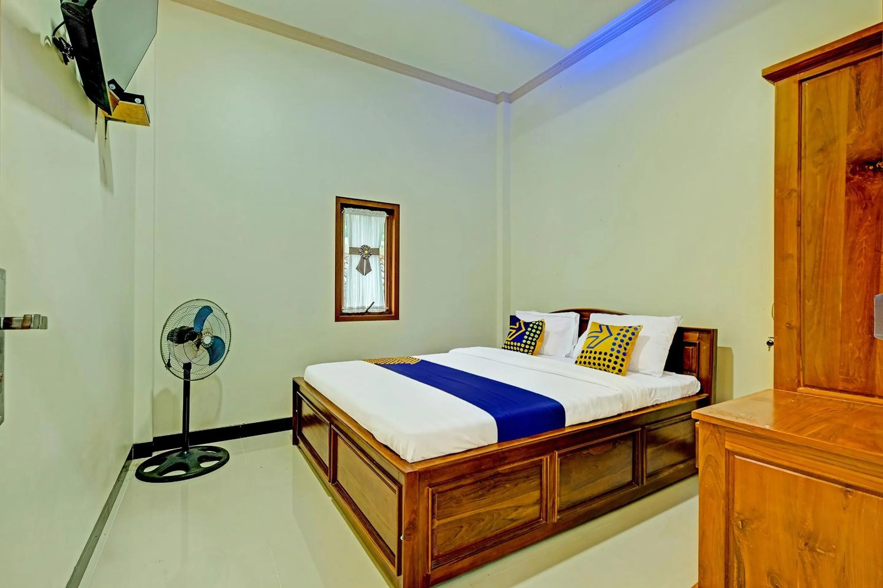 Bedroom in OYO Homes 91095 Desa Wisata Conto