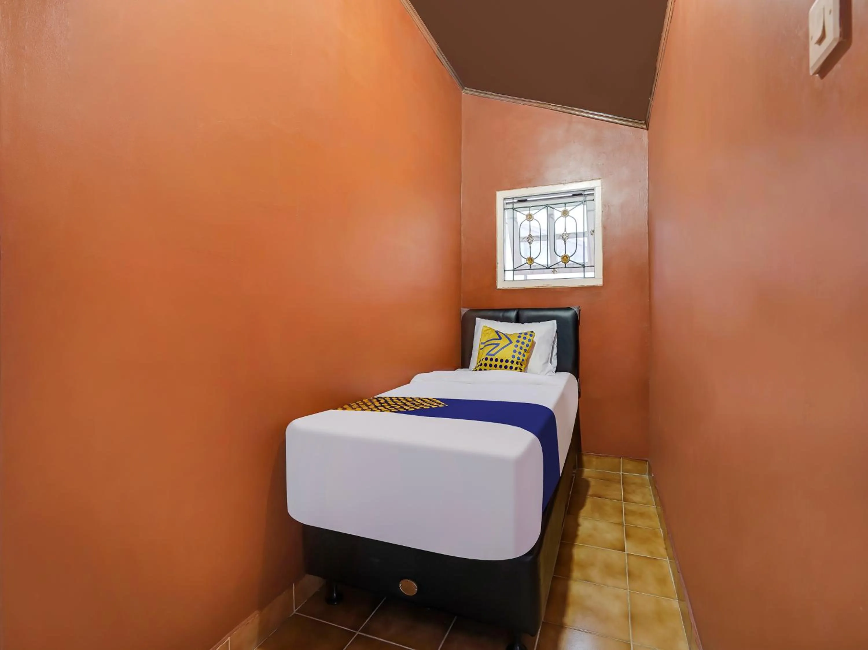 Bedroom in SPOT ON 91107 Villa Galaxy Resort