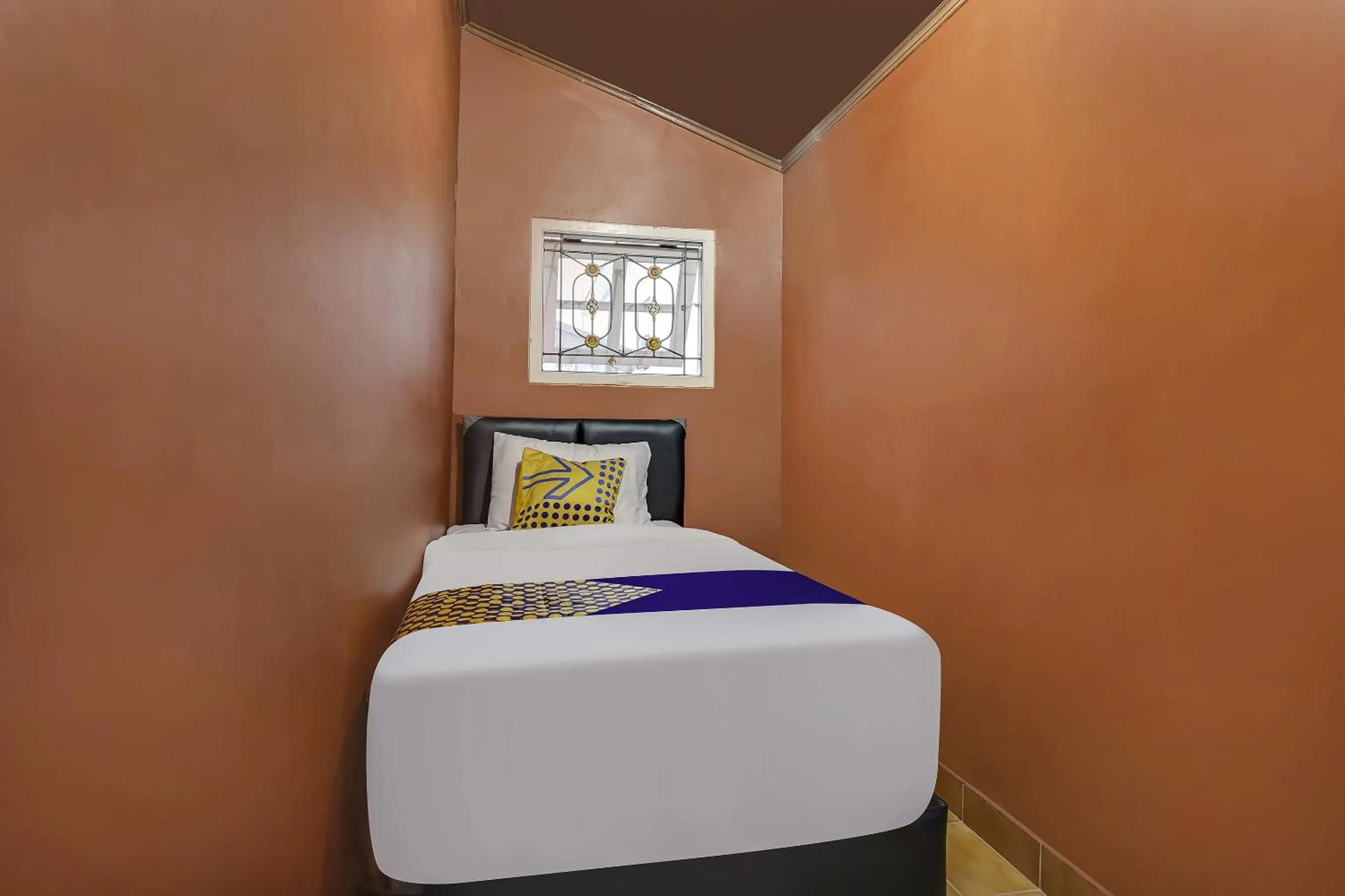 Bedroom in SPOT ON 91107 Villa Galaxy Resort