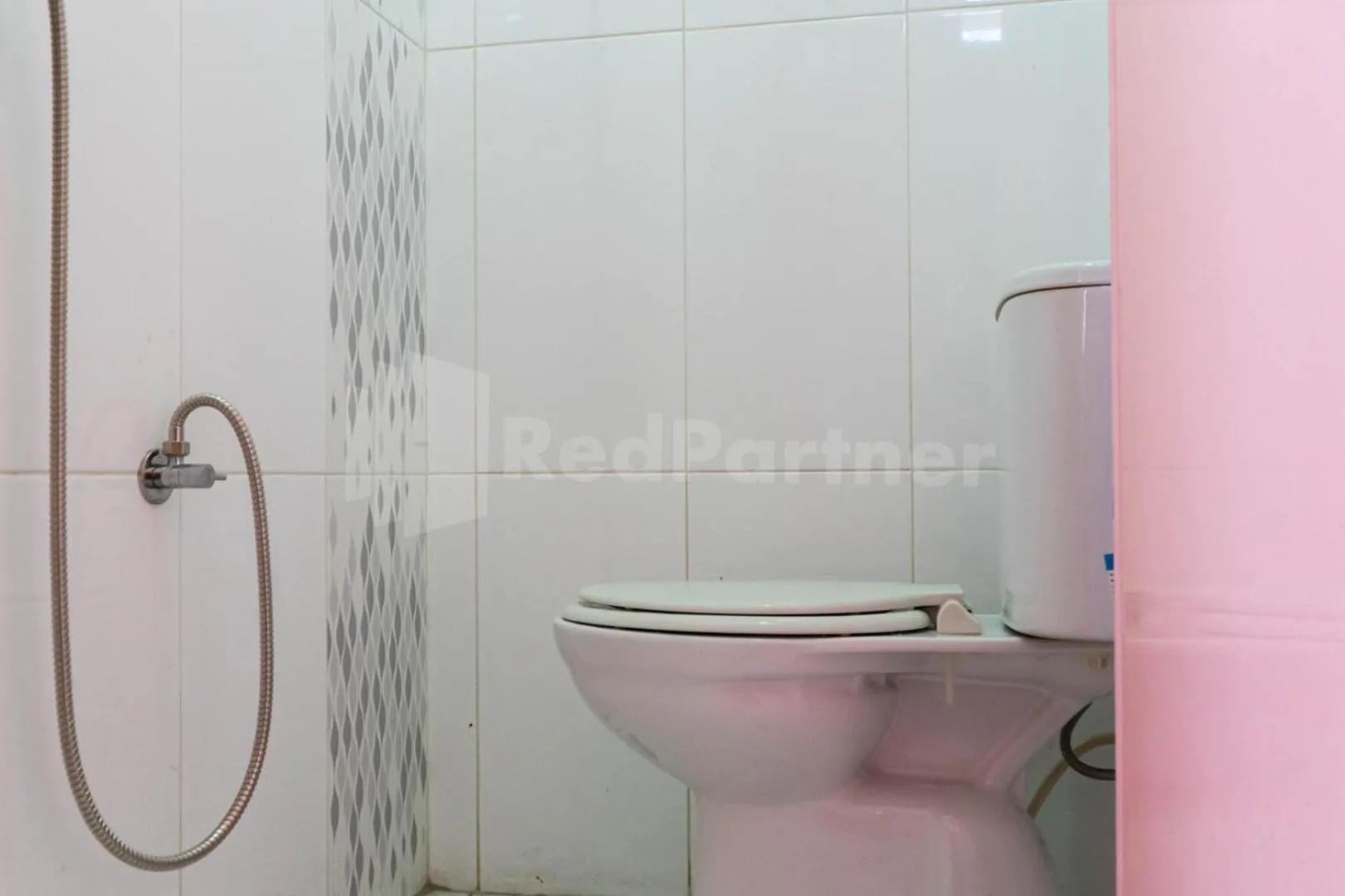 Bathroom in Asri Residence near Jalan Iskandar Muda Medan Mitra RedDoorz