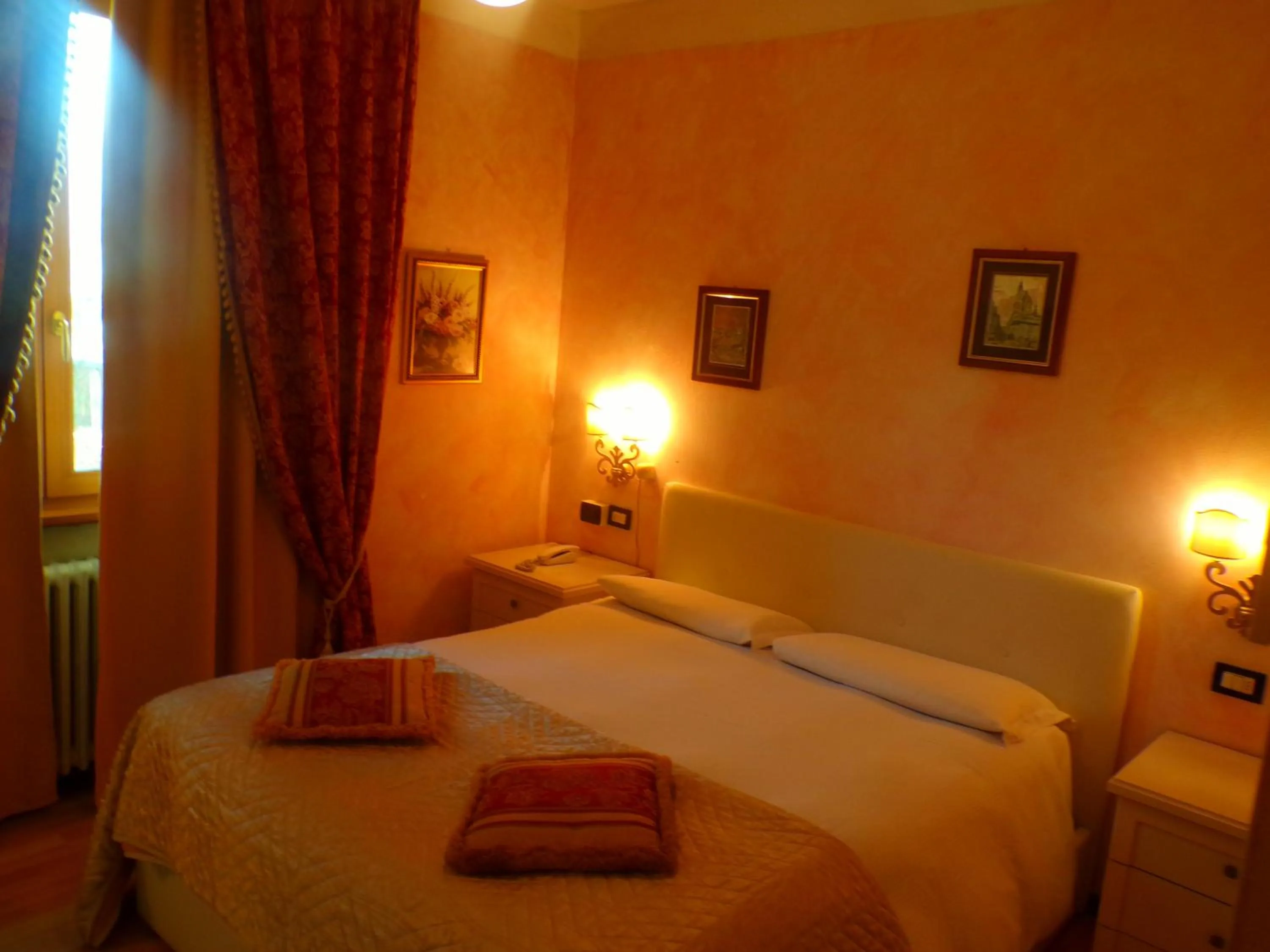 Bed in Hotel San Marino