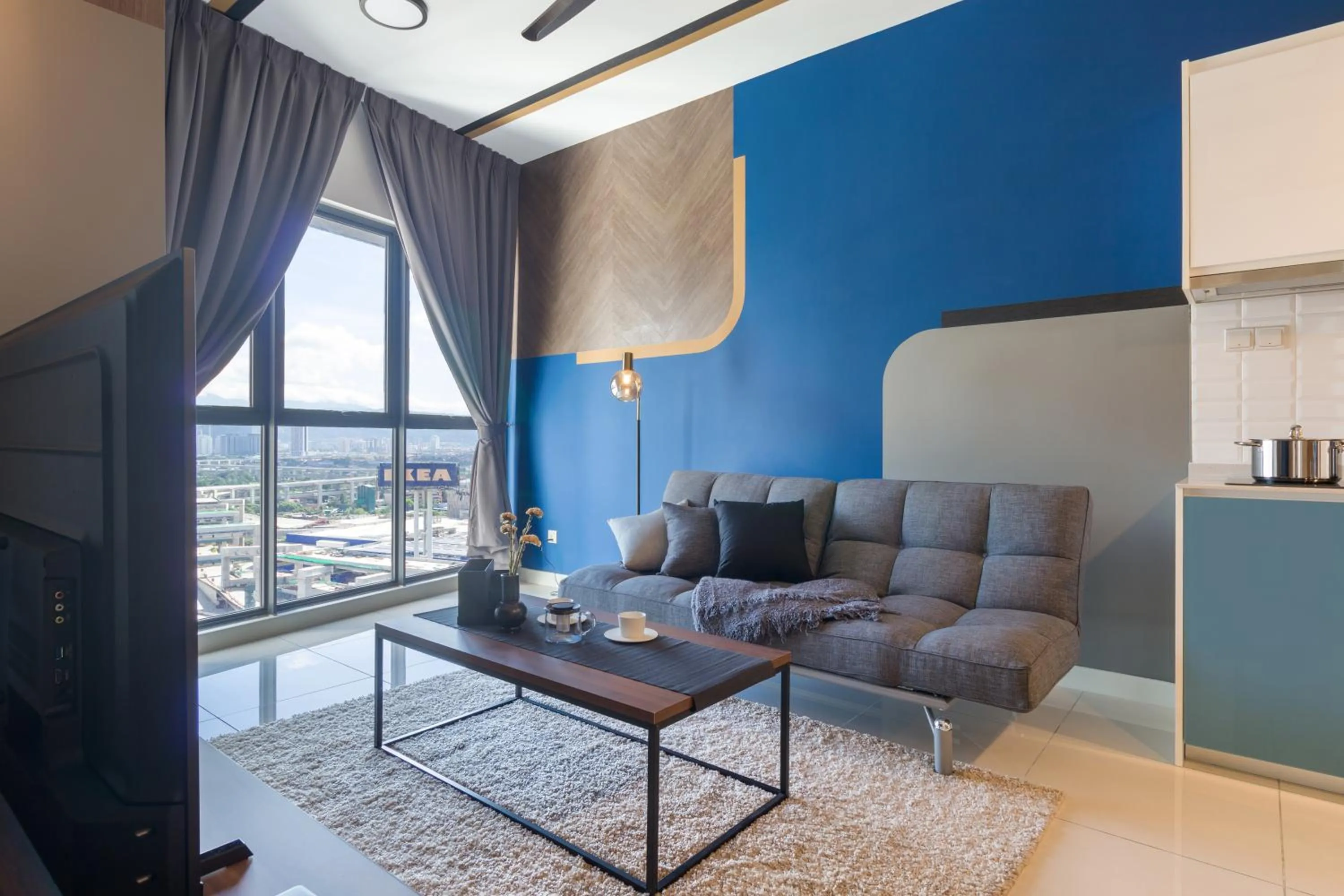 Living room in Continew Residensi by Airhost
