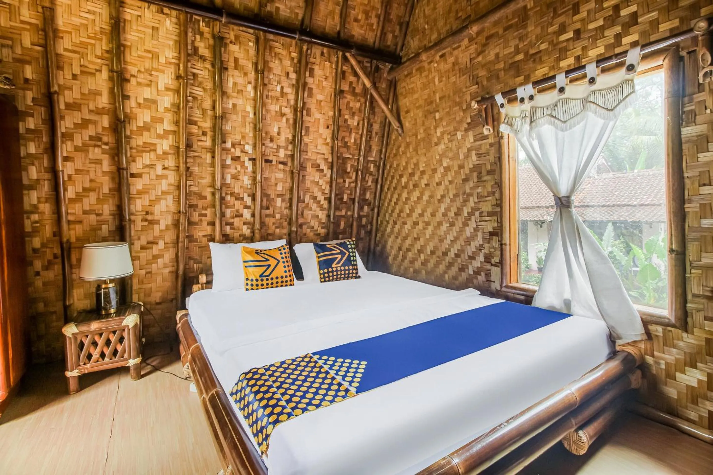 Bedroom, Bed in Hotel O Desa Wisata Bangunharja