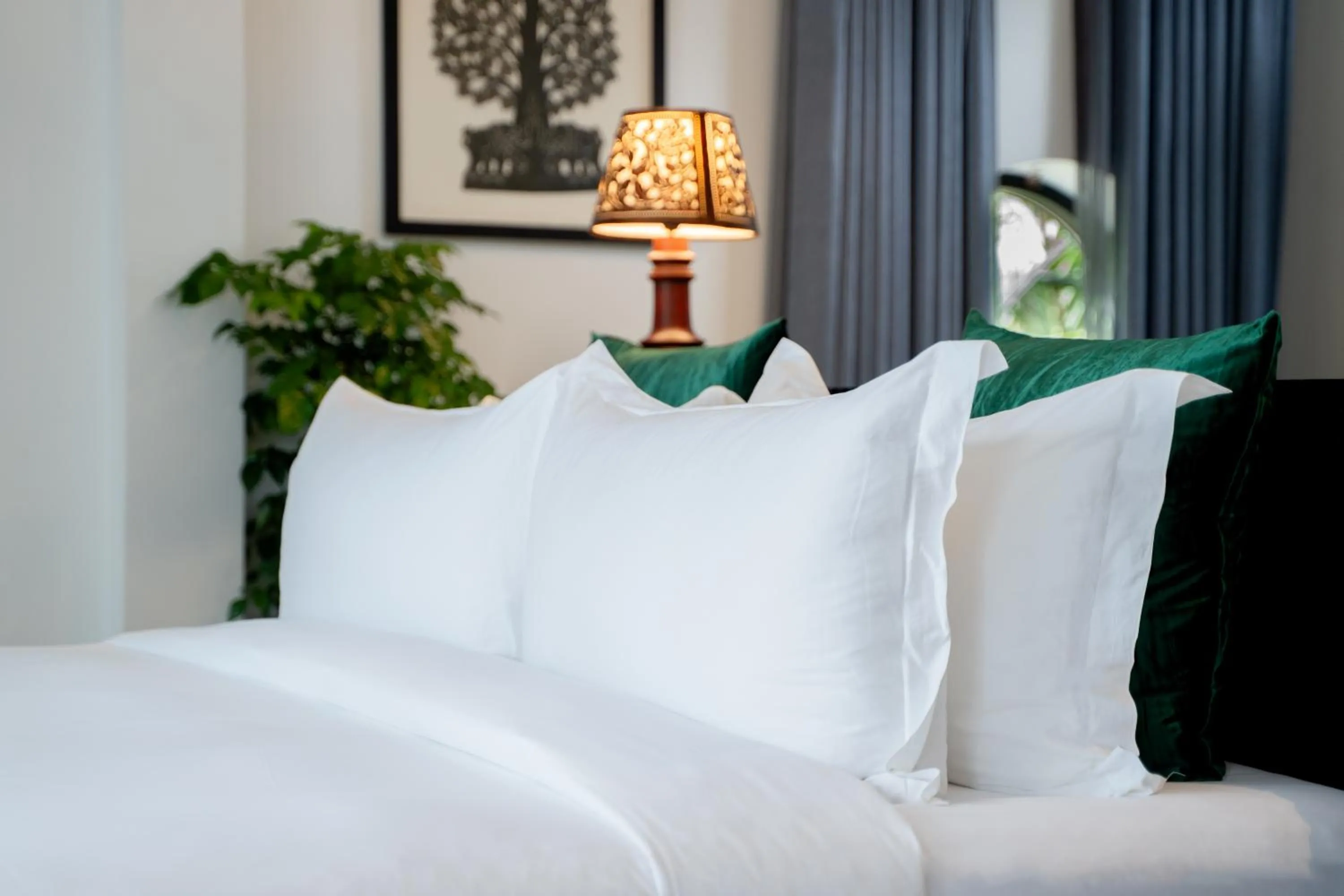 Bed in RiverTree Villa & Resort