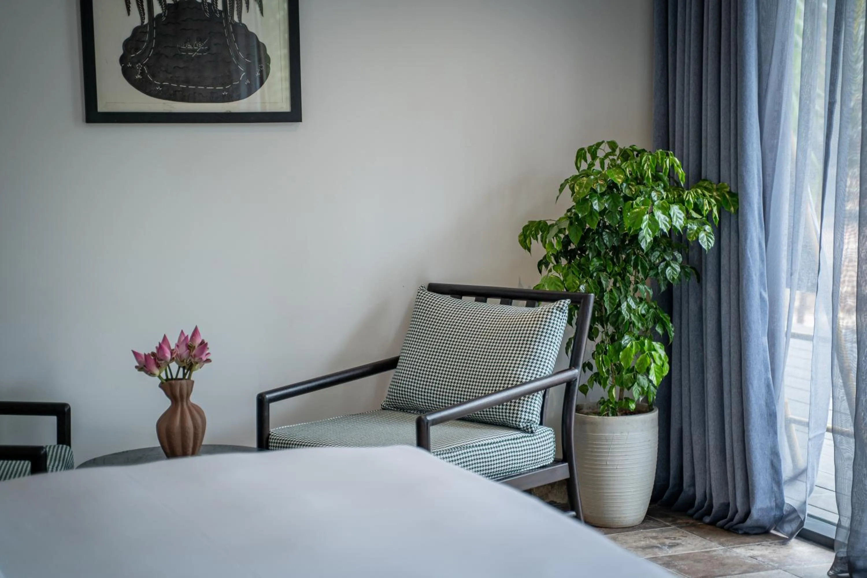 Seating area, Bed in RiverTree Villa & Resort