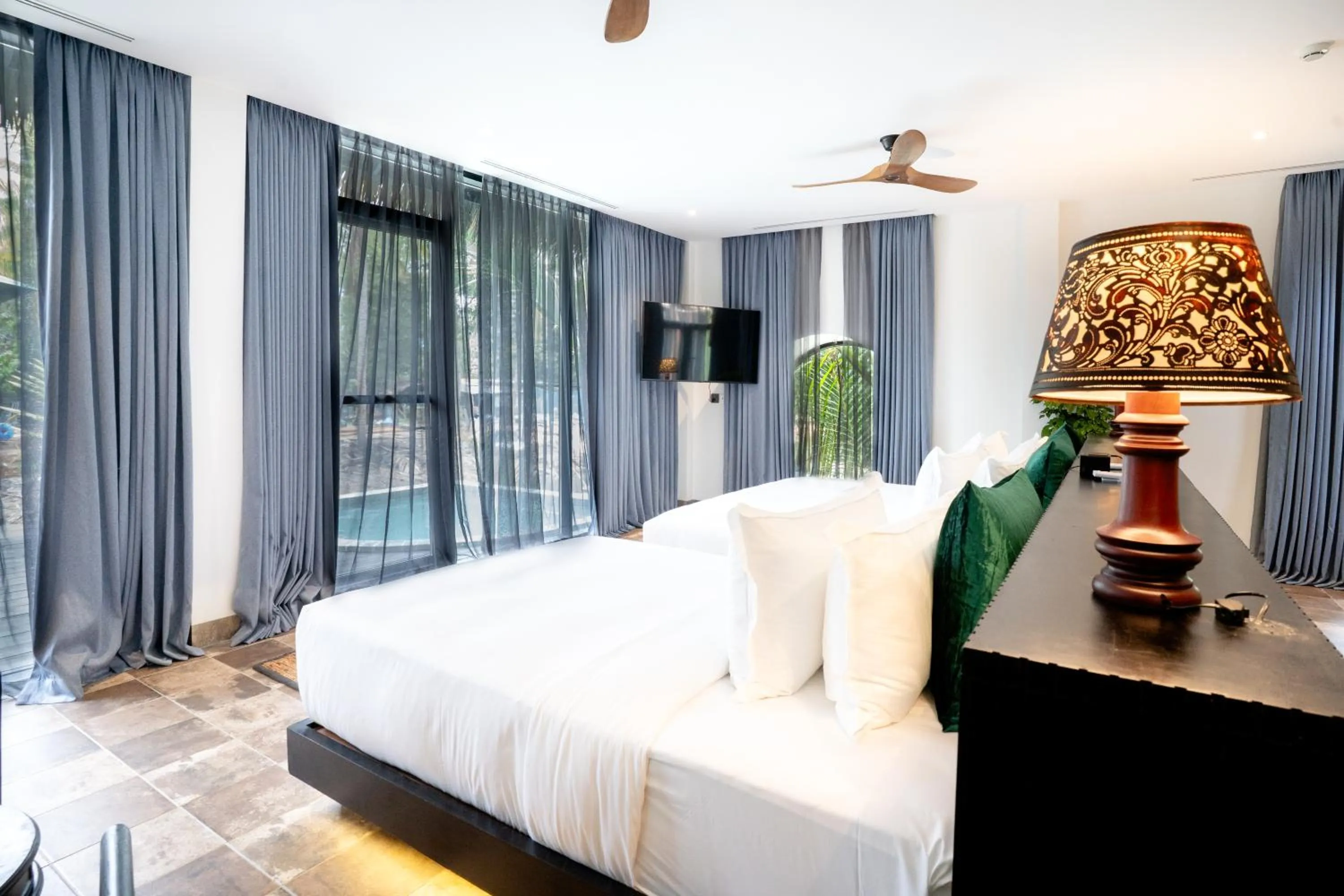 Bed in RiverTree Villa & Resort