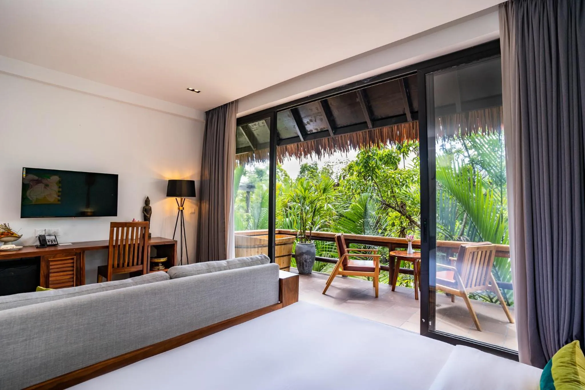 Bed in RiverTree Villa & Resort