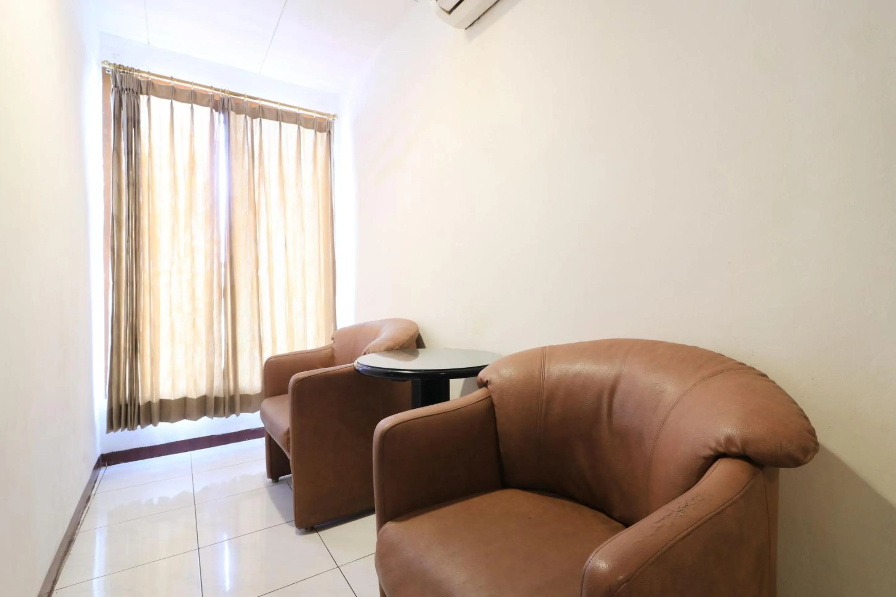 Seating area in Mroom Prapancha