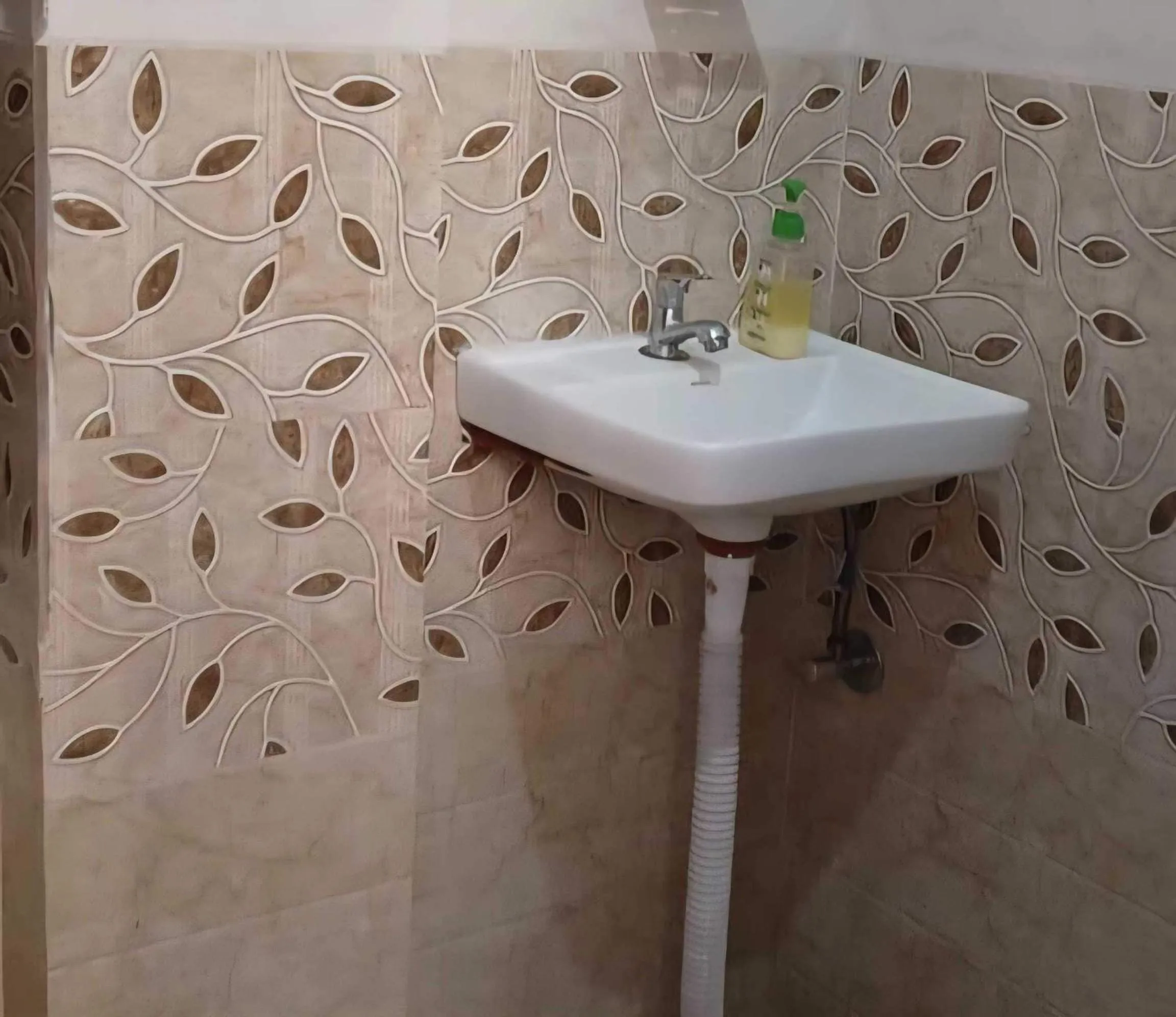 Bathroom in OYO 87047 Blossom inn