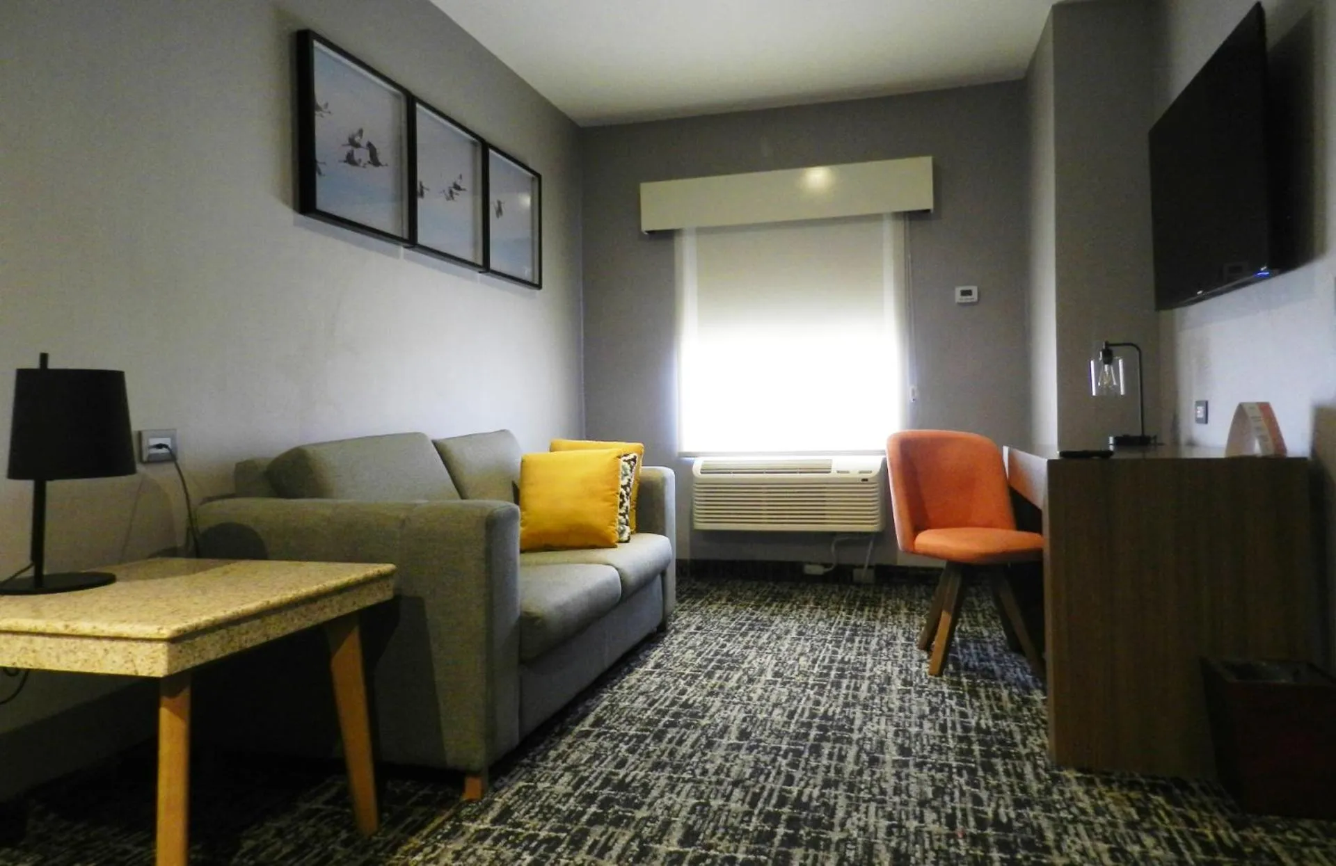 Living room in voco Saltillo Suites by IHG