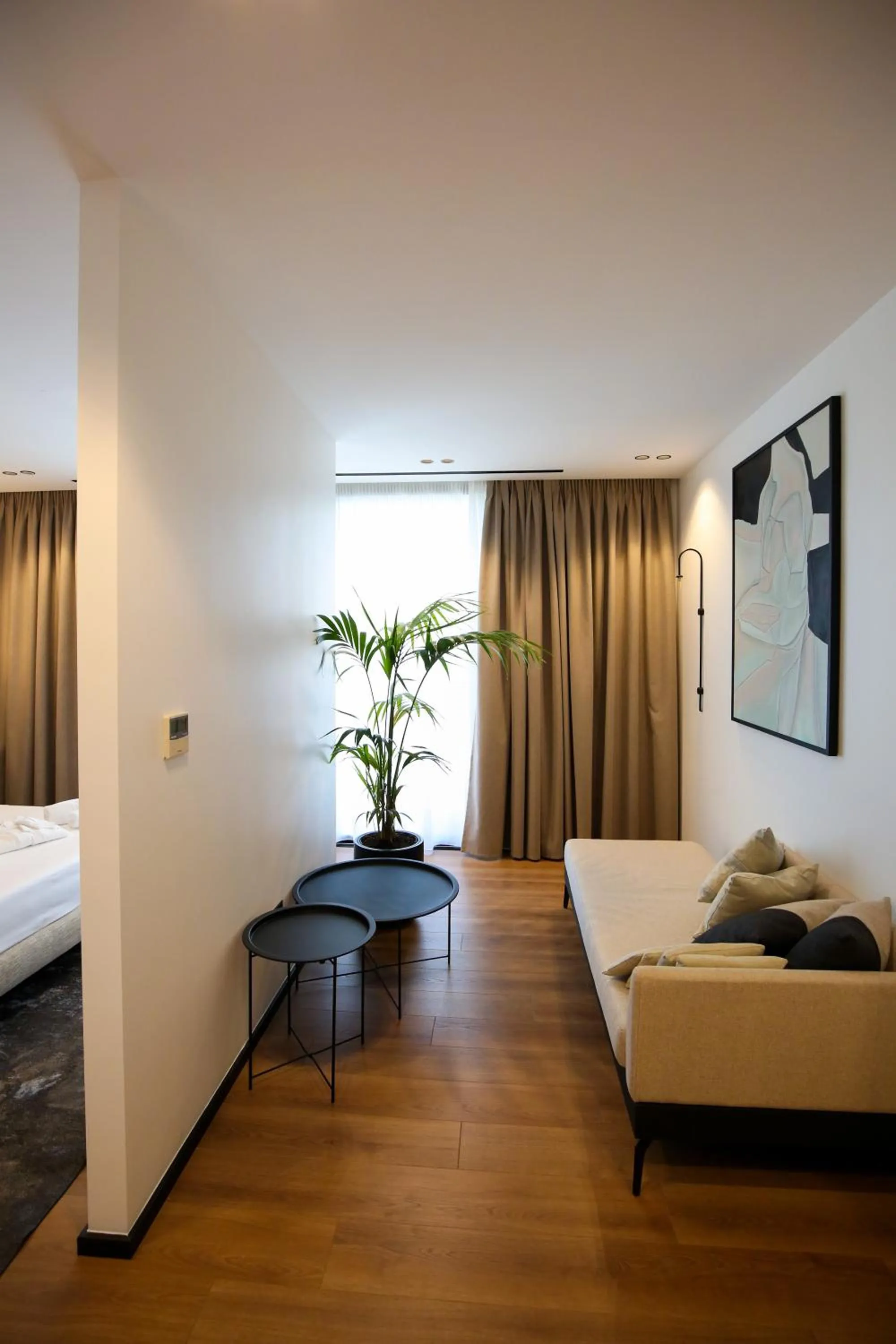 Seating area, Bed in Nobus Hotel & Spa