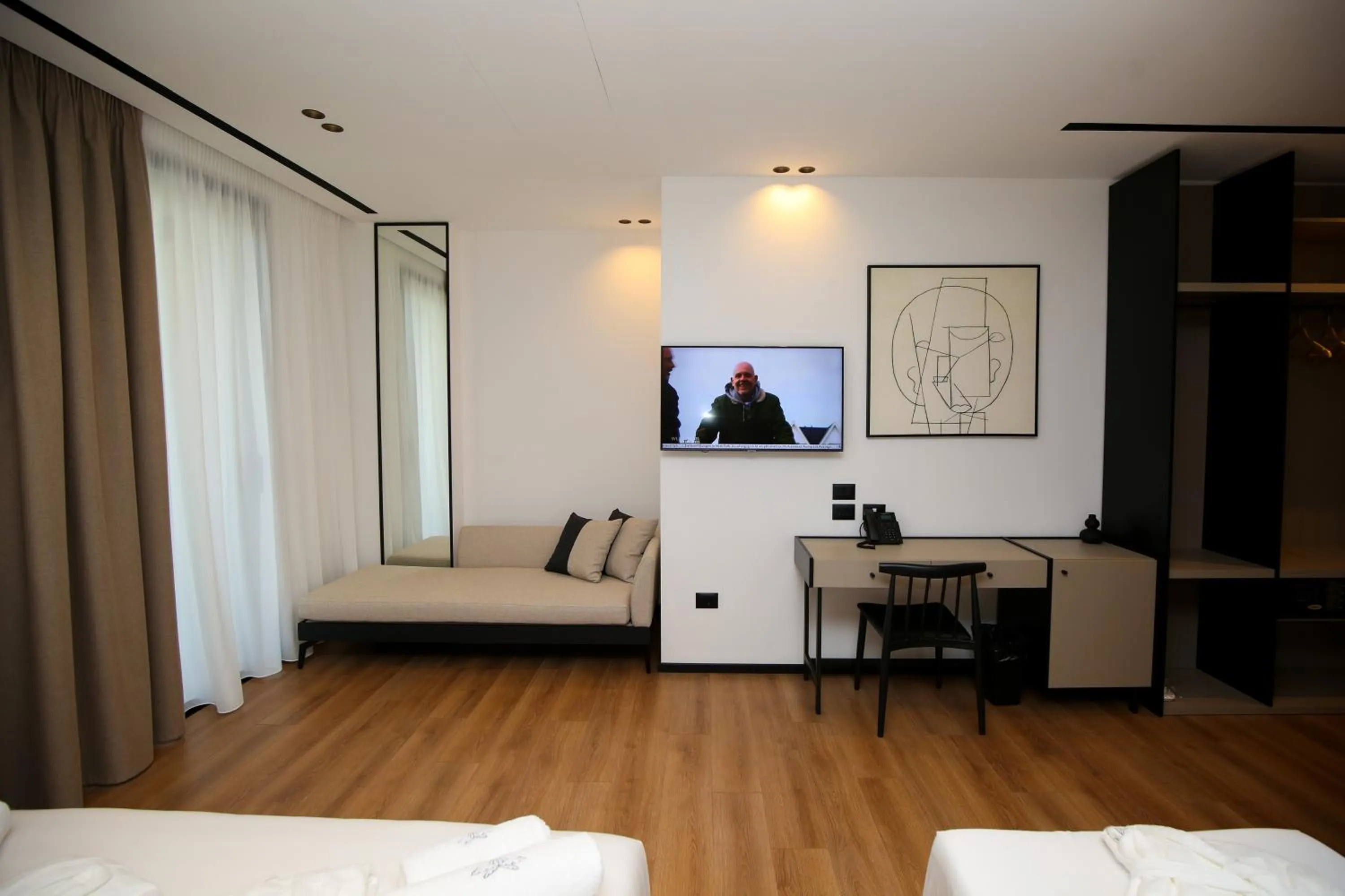 Seating area, Bed in Nobus Hotel & Spa