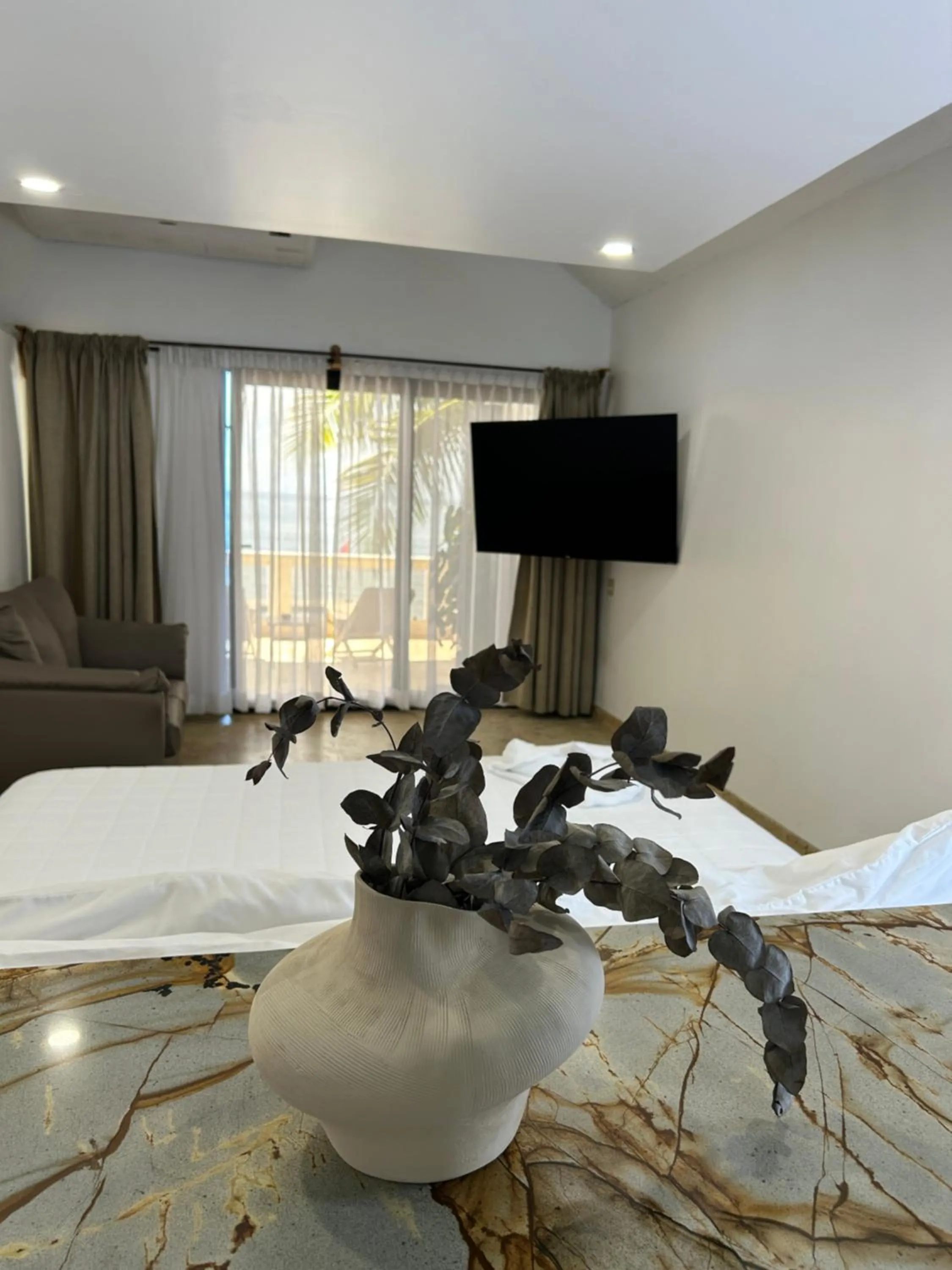 Bed in Brisas Del Mar Beach + Dive Resort