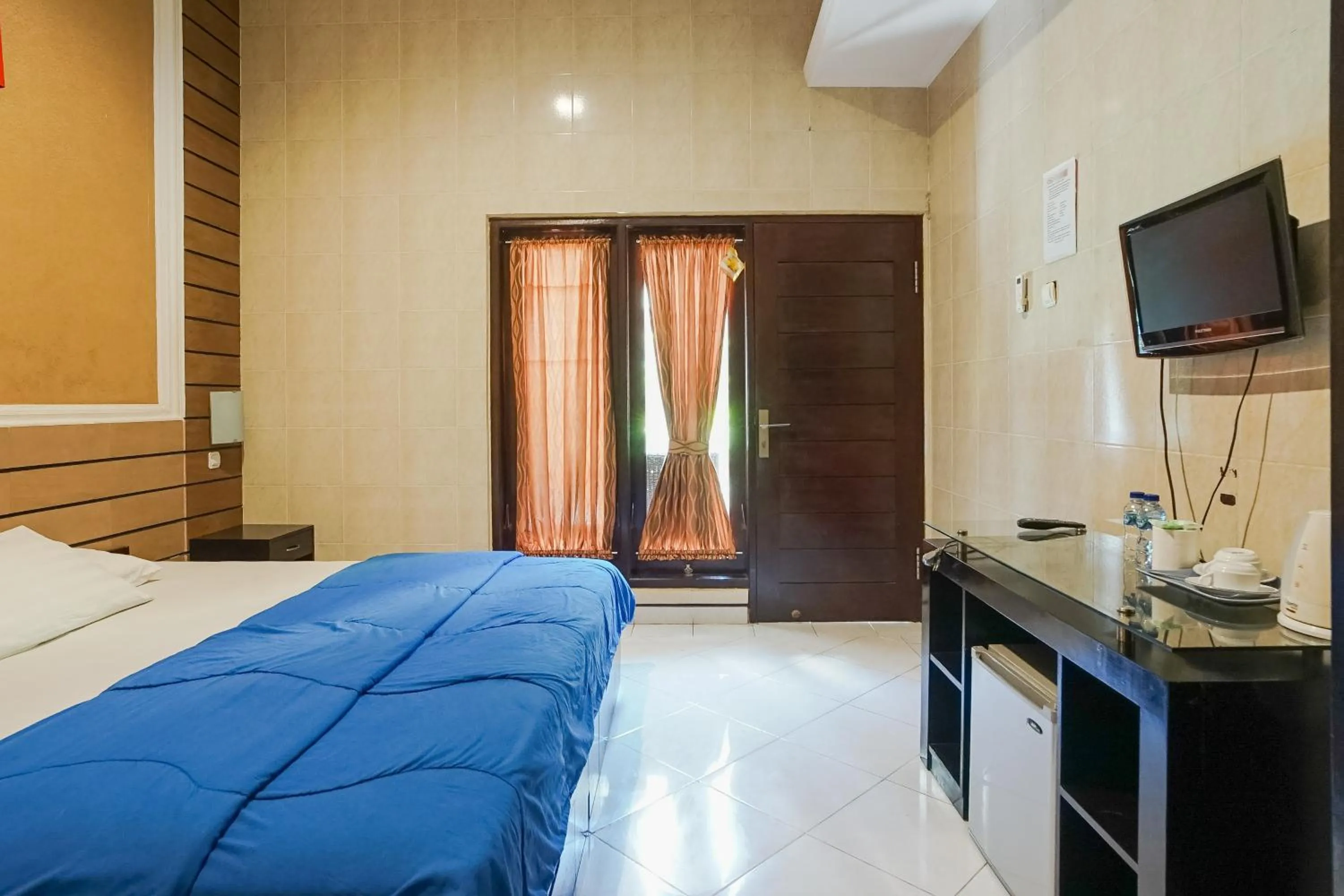 Bed in DENAYS GUESTHOUSE JIMBARAN