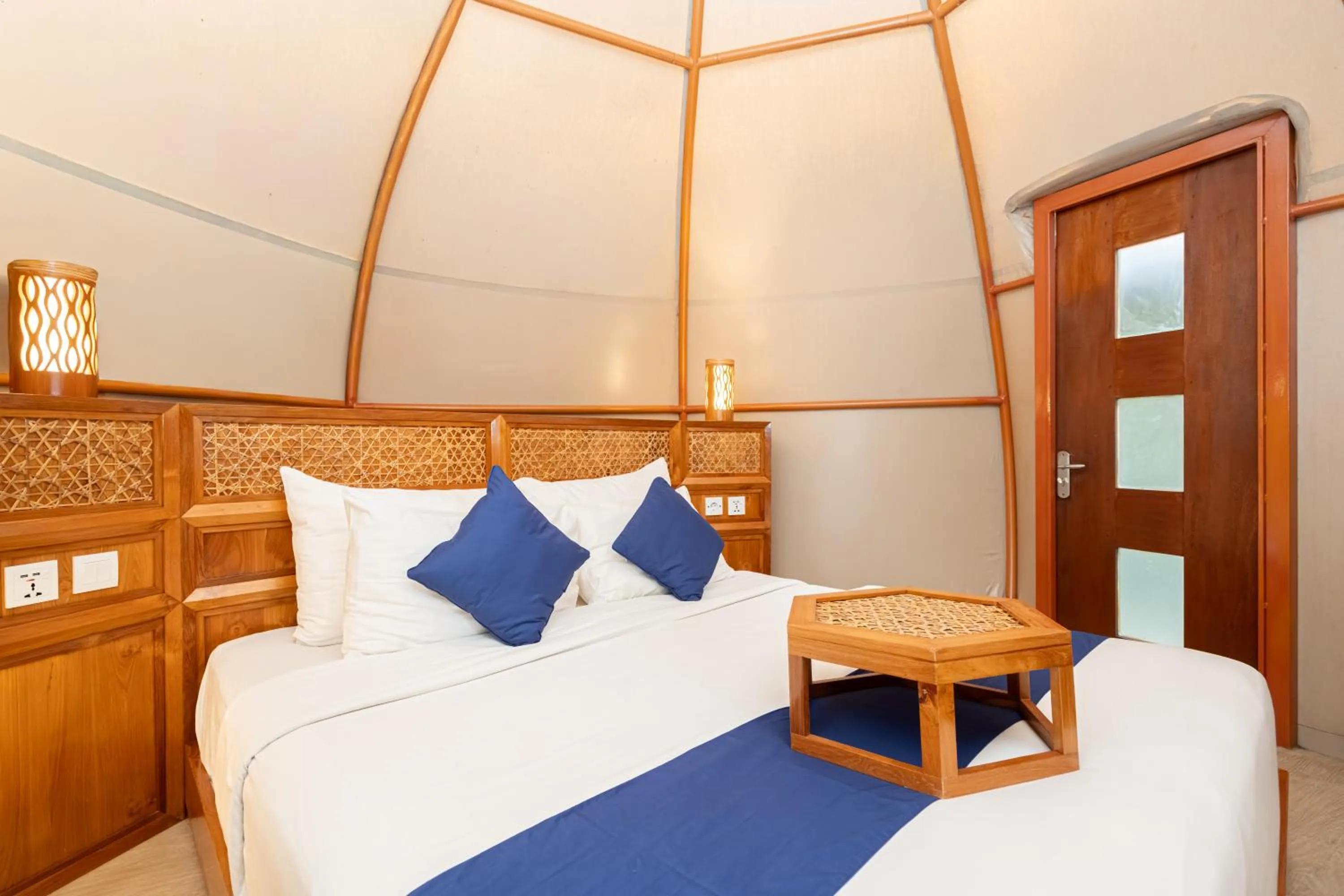 Bed in Triyana Resort and Glamping