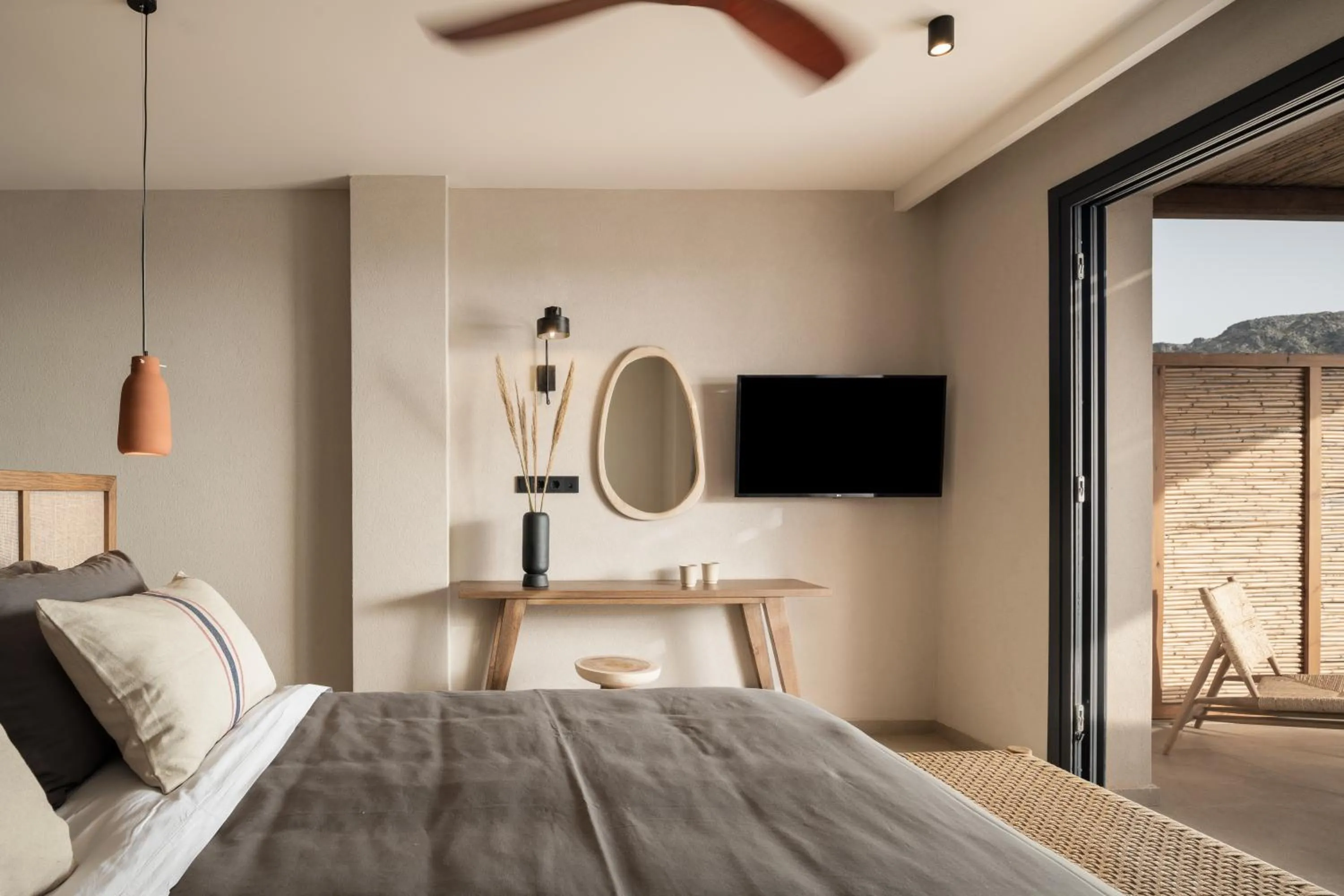 Bed in KYMANI Boutique Hotel & Suites