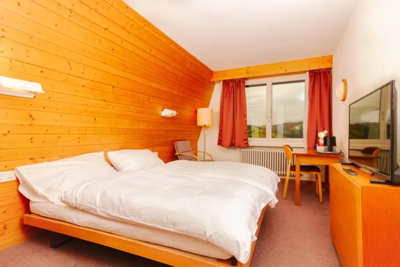 Bed in Hotel Swiss Views