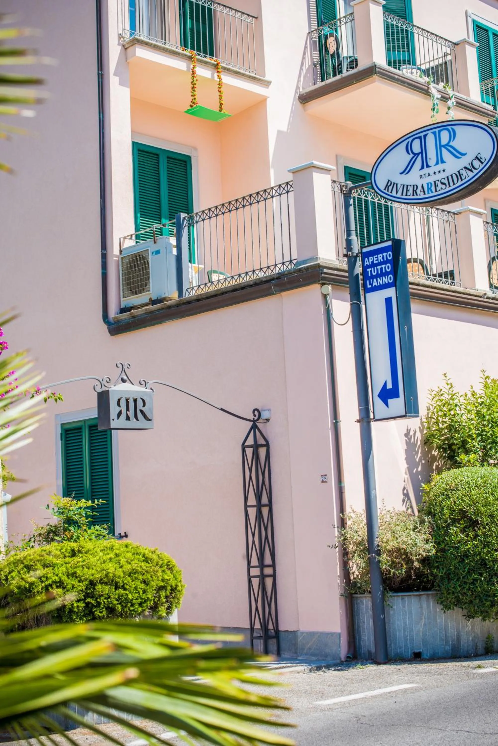 Property logo or sign in Riviera Residence