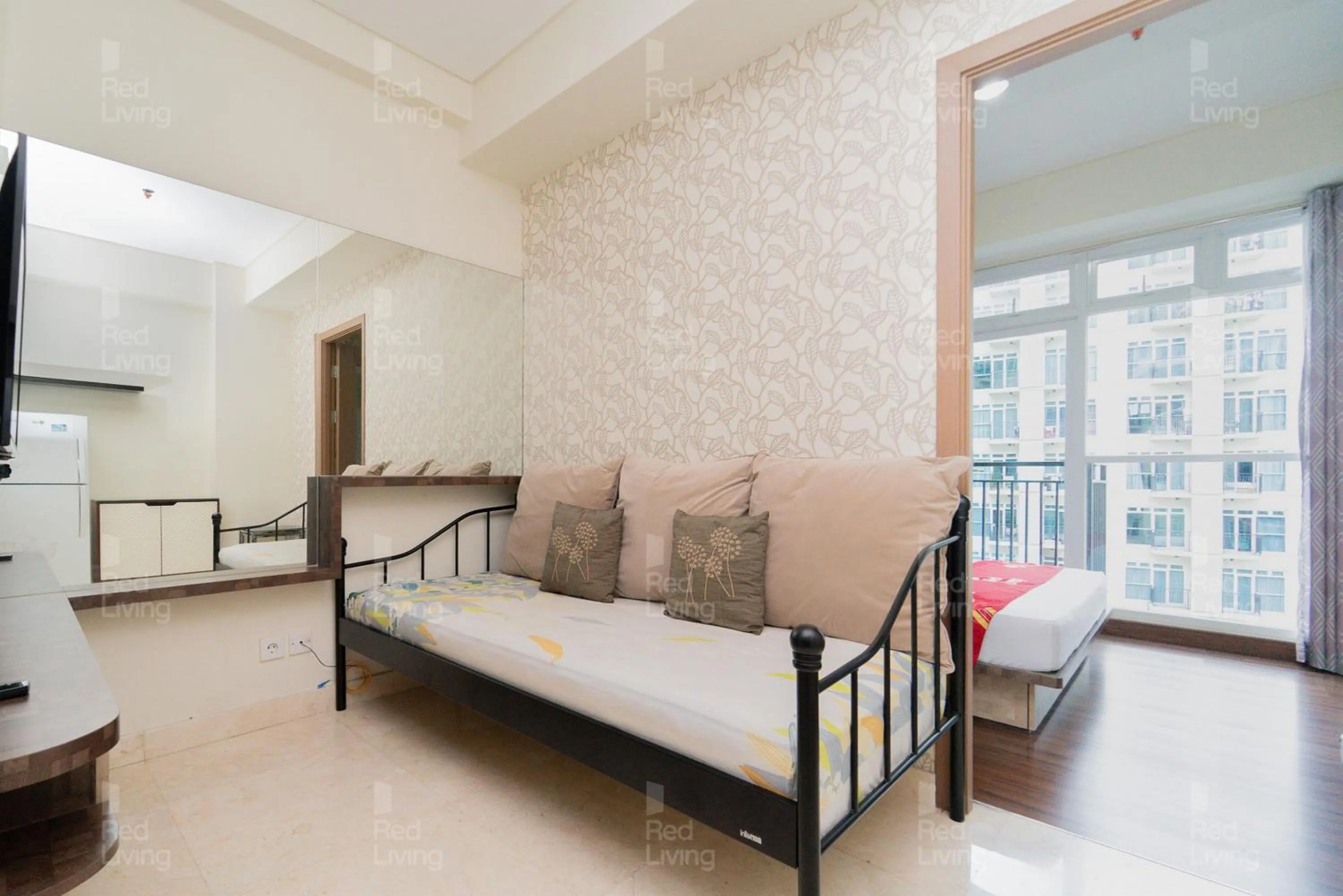 Living room, Bed in RedLiving Apartemen Puri Orchard - Tower Magnolia