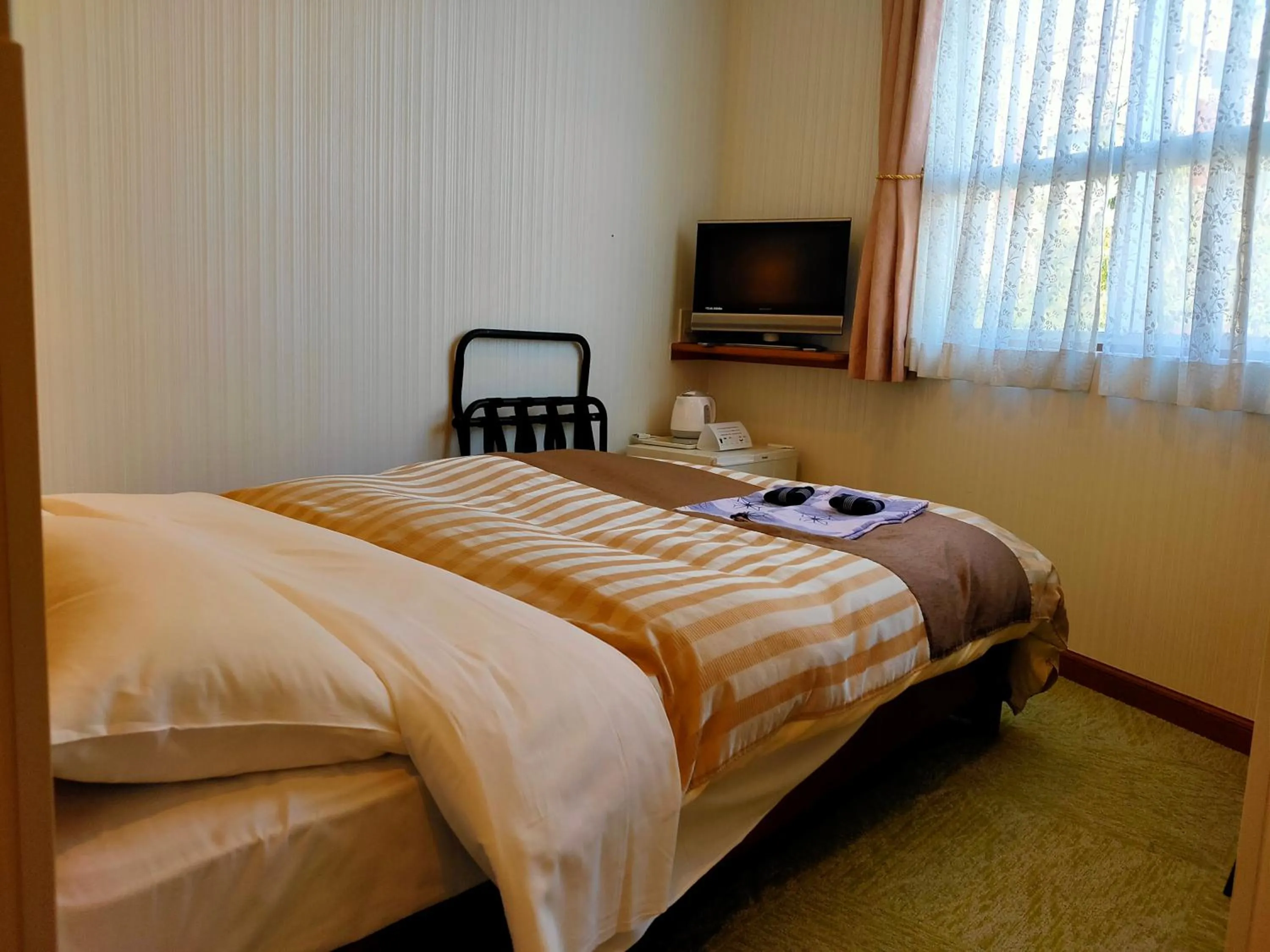 Bed in Beppu Station Hotel