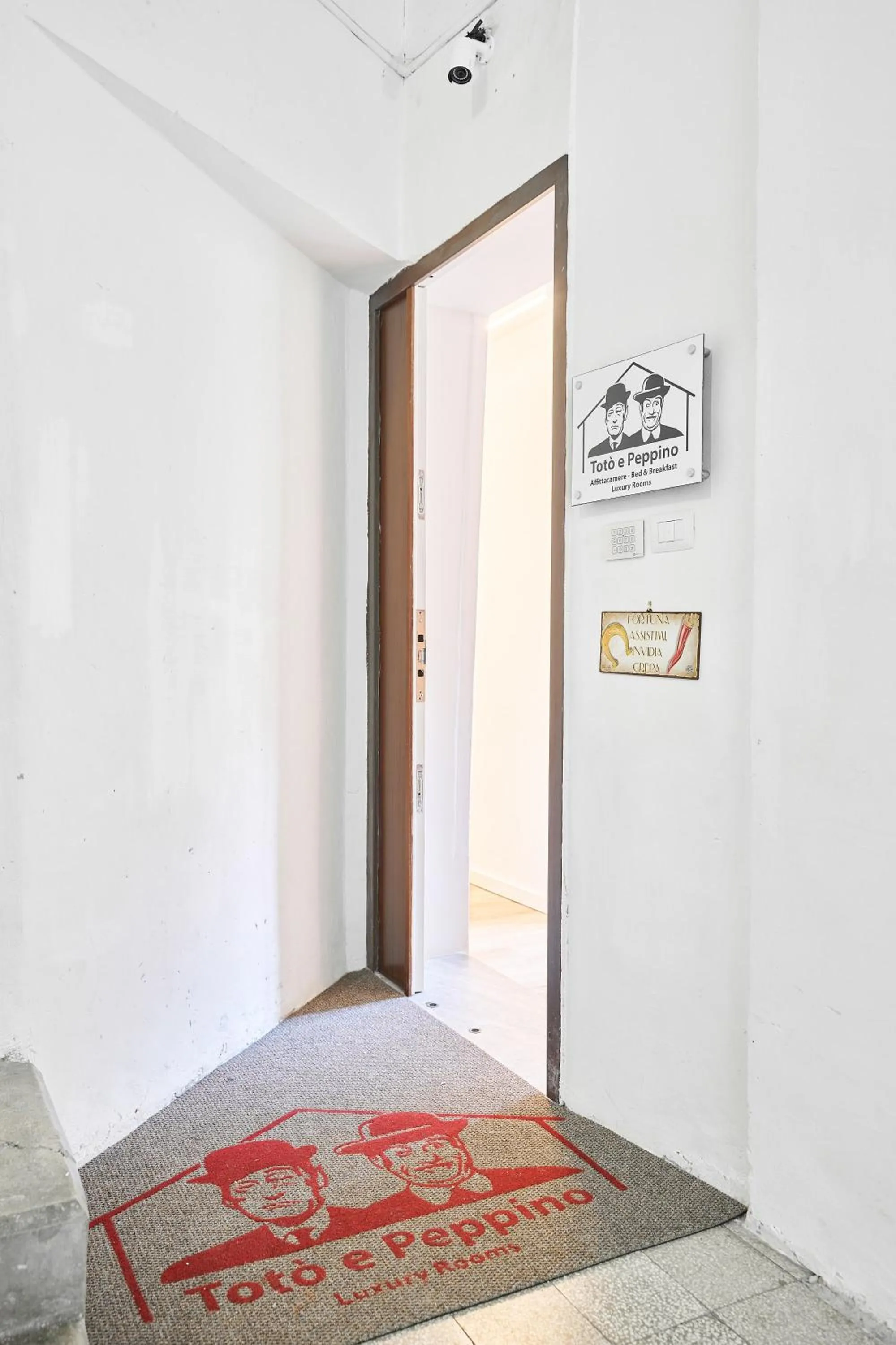 Property logo or sign, Bed in Toto e Peppino Luxury Rooms