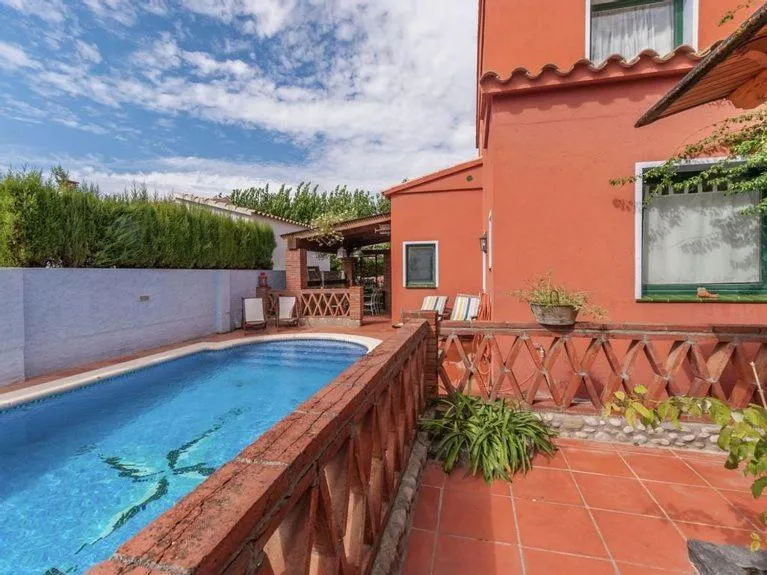 Swimming pool in Cozy holiday home with pool in St Pere Pescador