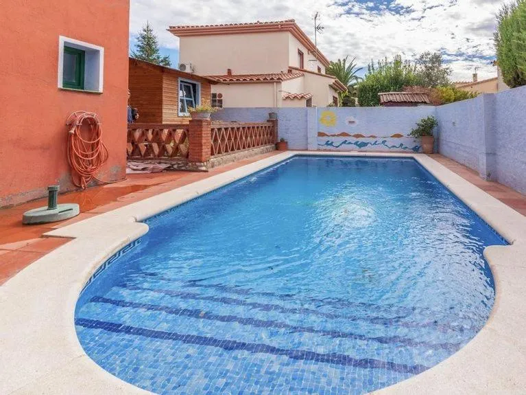 Swimming pool in Cozy holiday home with pool in St Pere Pescador
