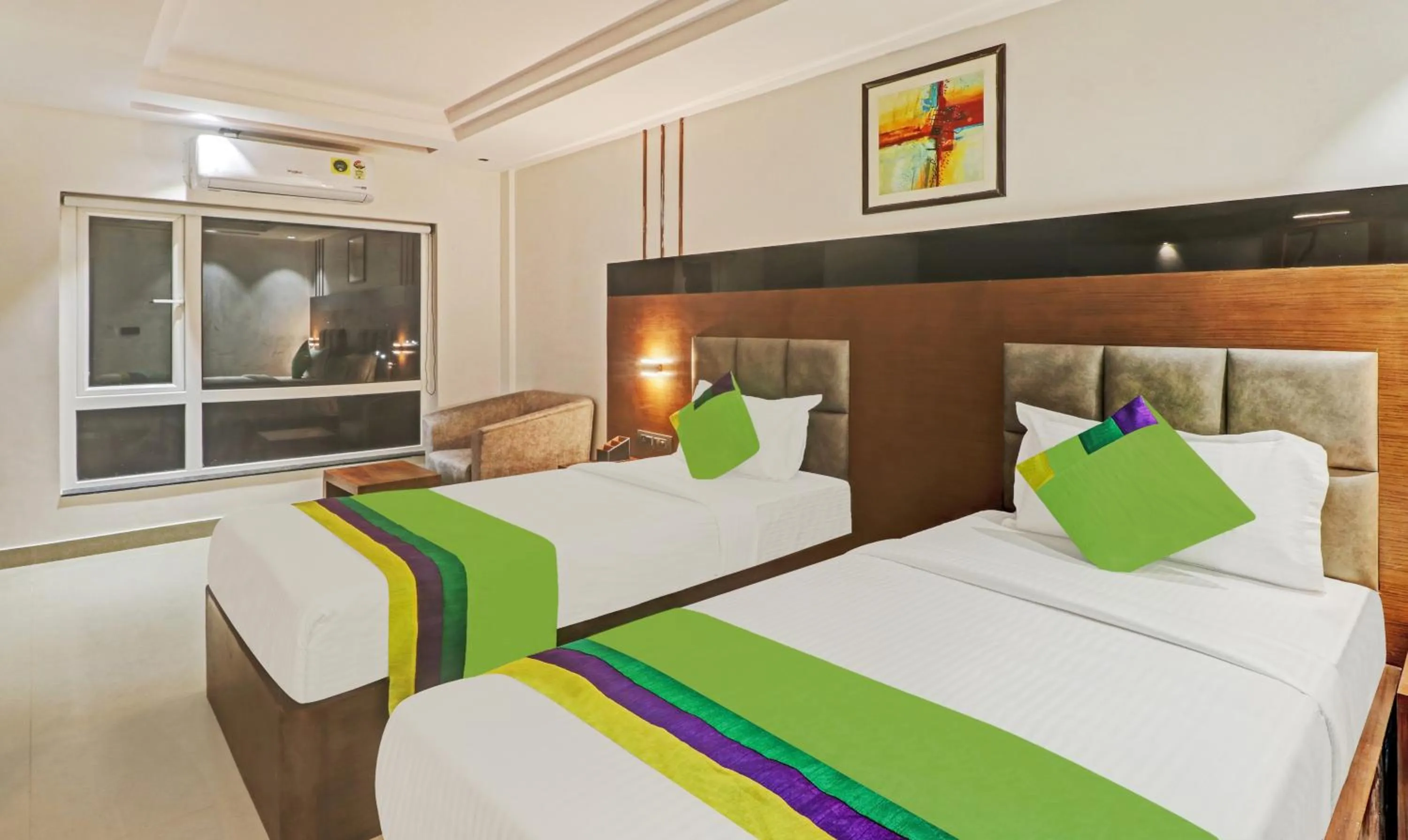 Photo of the whole room, Bed in Treebo Emora Grand