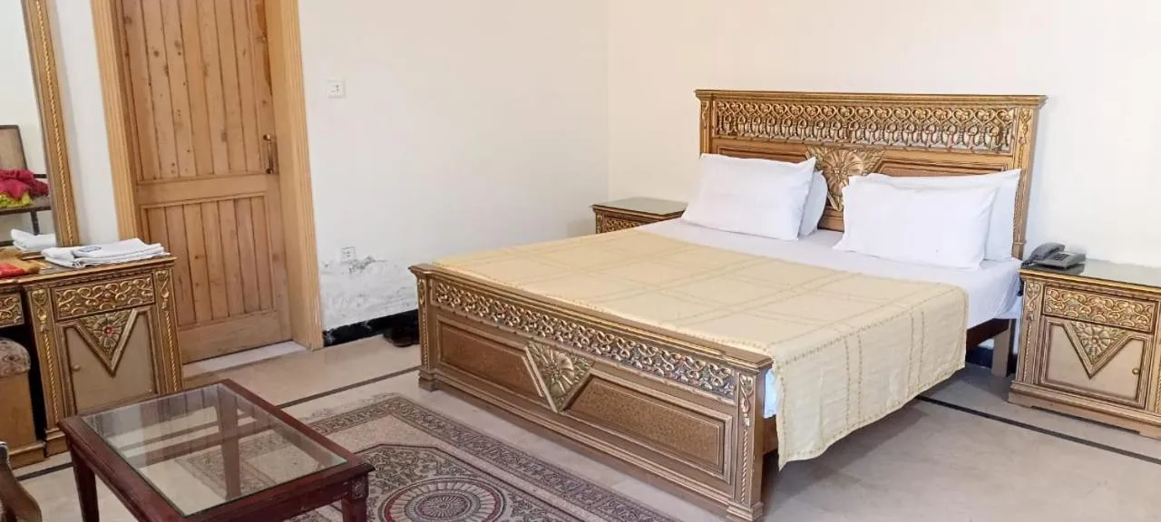 Photo of the whole room, Bed in Luxury Palace Peshawar