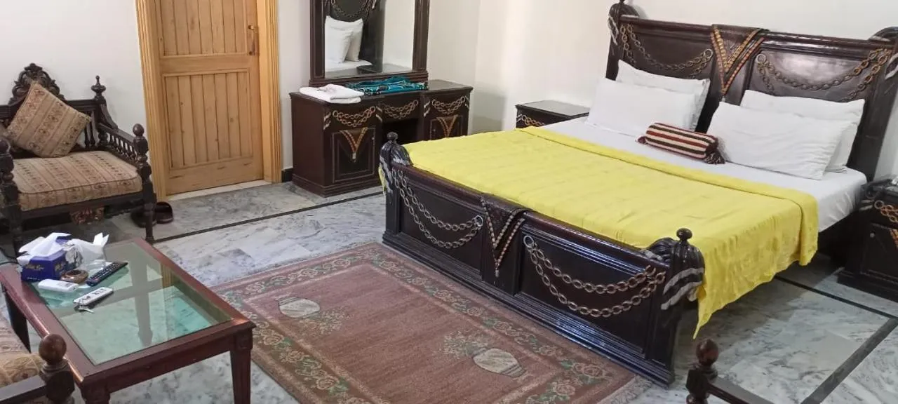 Photo of the whole room, Bed in Luxury Palace Peshawar