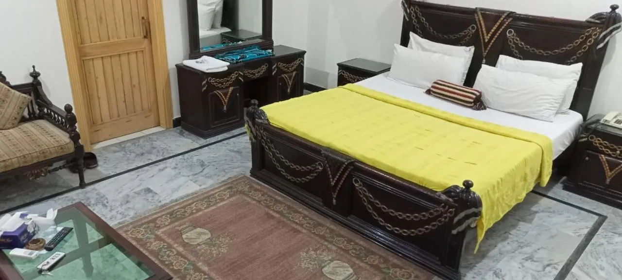 Photo of the whole room, Bed in Luxury Palace Peshawar