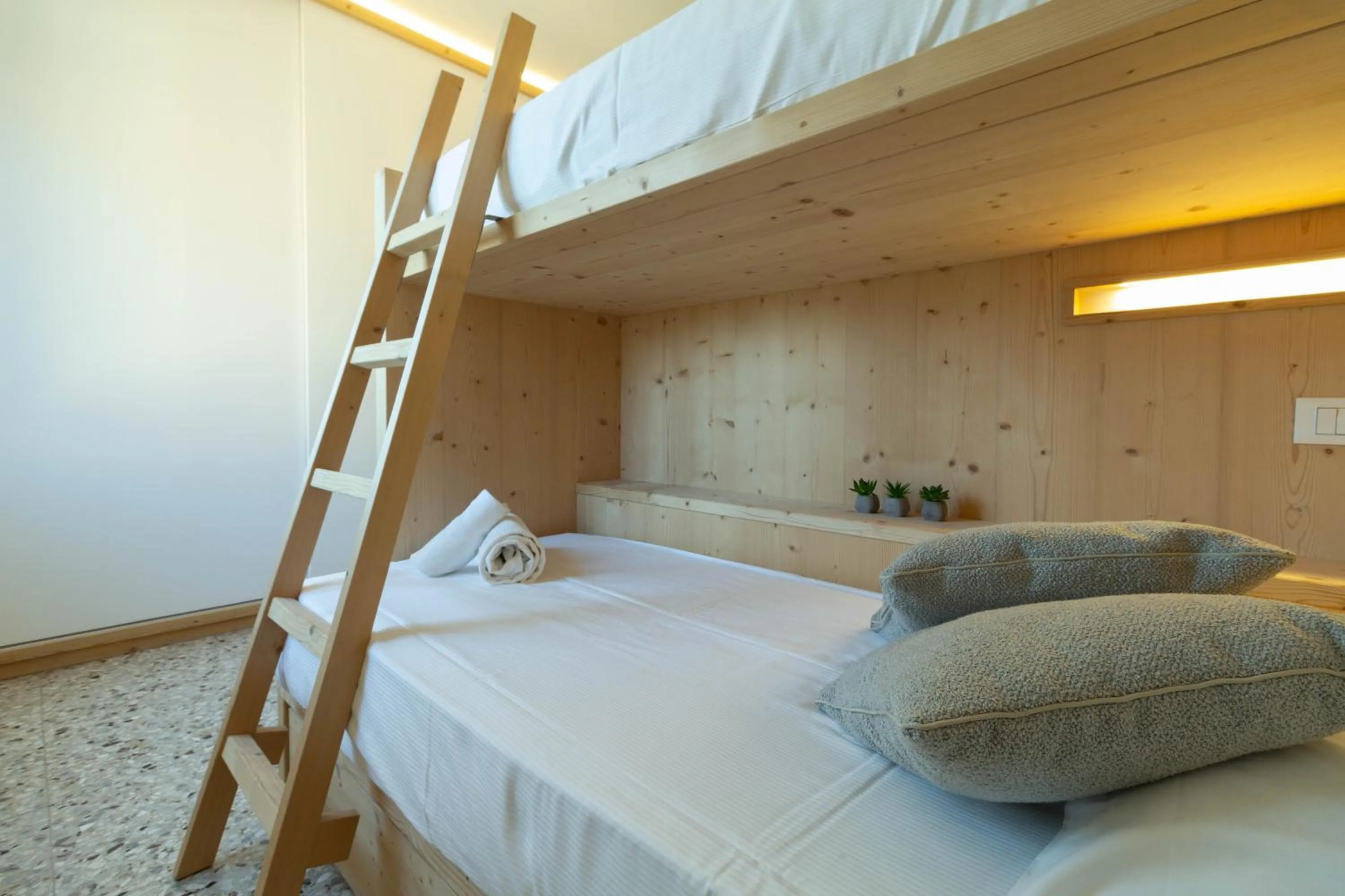 Bed in Mamma Ciccia Holiday Home - Waterfront Apartment