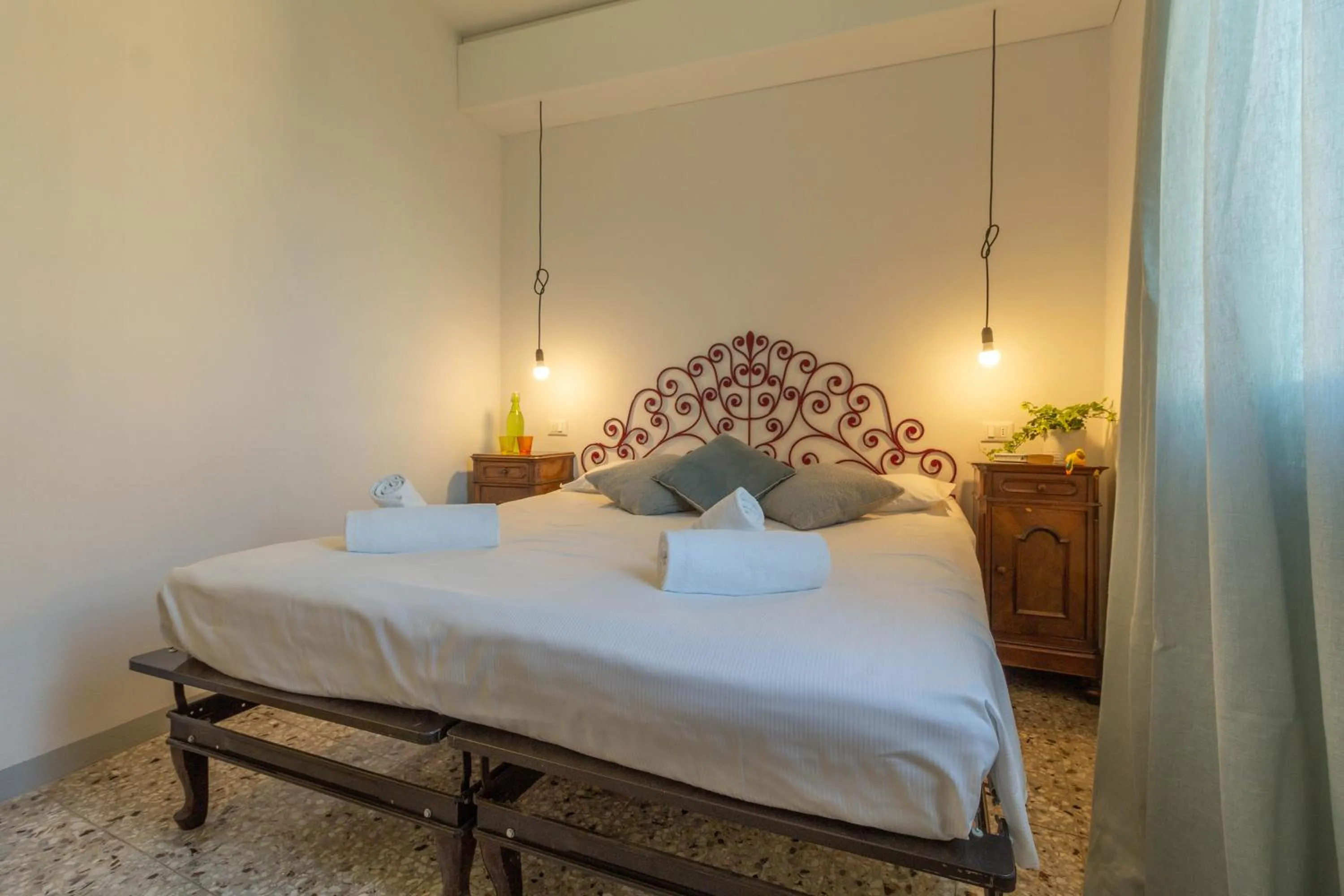 Bed in Mamma Ciccia Holiday Home - Waterfront Apartment