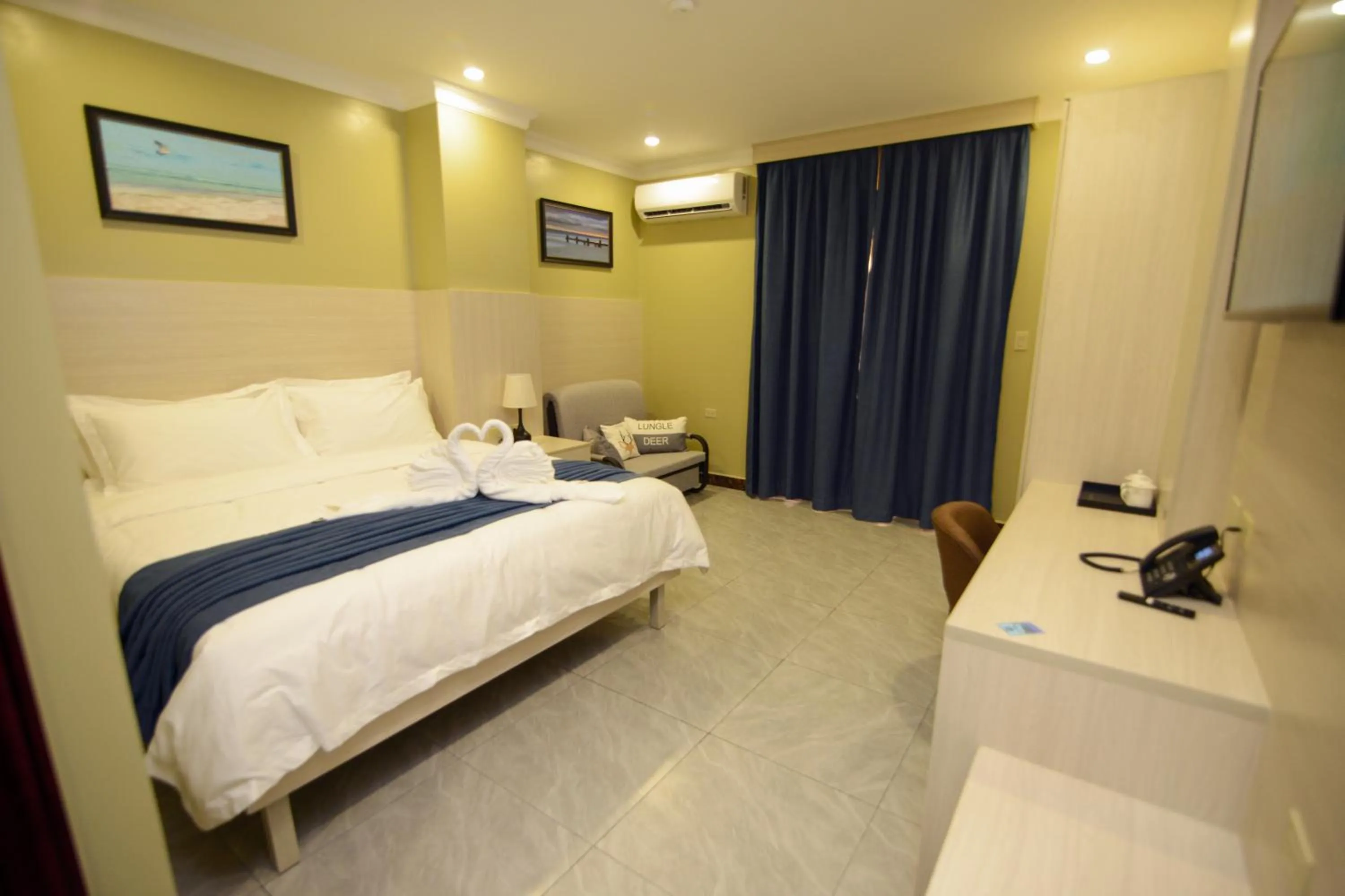 Photo of the whole room, Bed in The Caye Hotel Caye Caulker