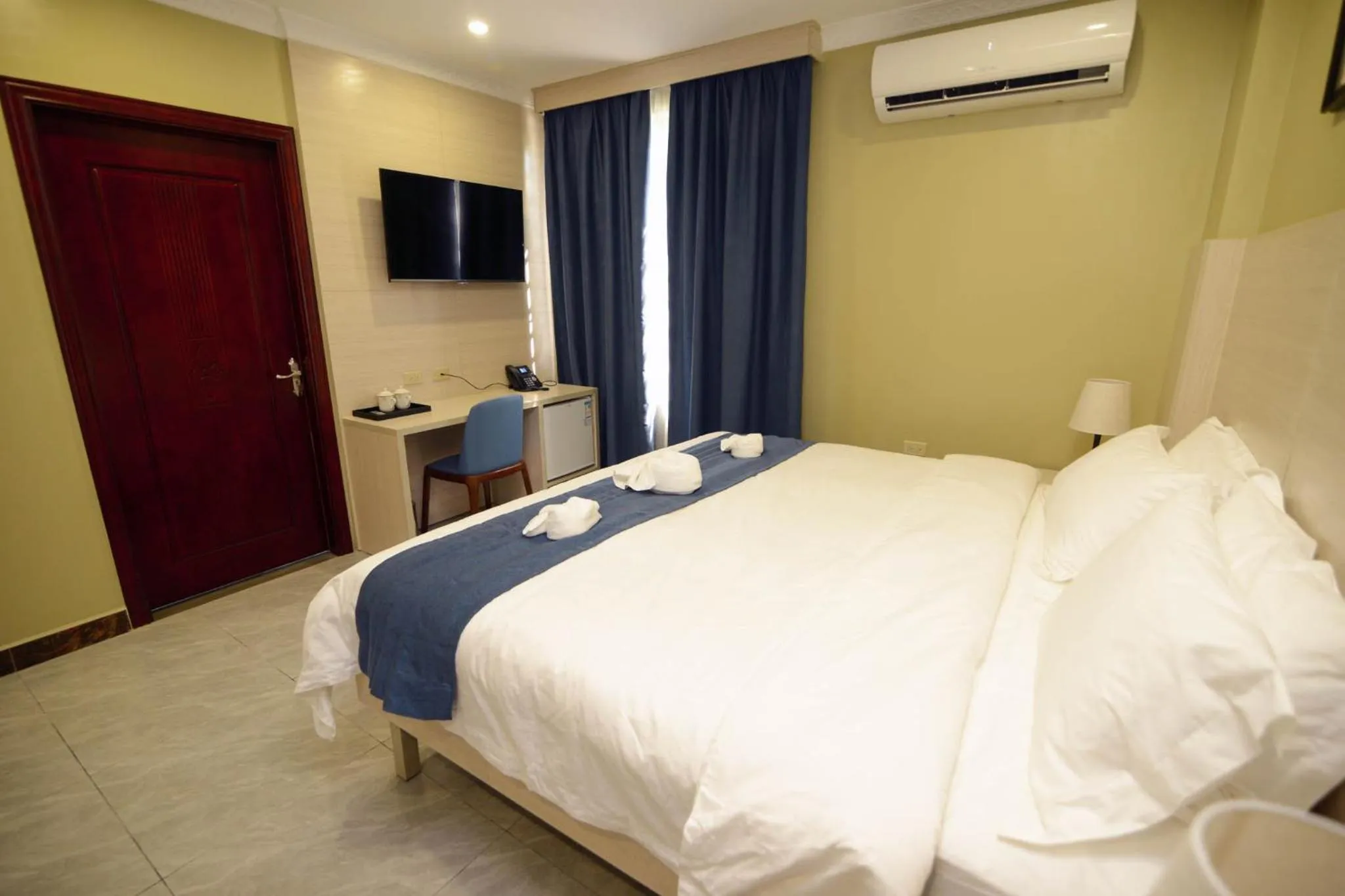 Photo of the whole room, Bed in The Caye Hotel Caye Caulker