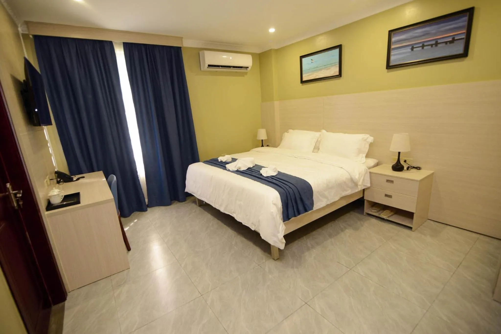 Photo of the whole room, Bed in The Caye Hotel Caye Caulker