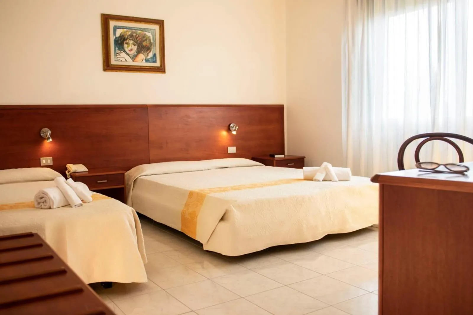 Bed in Hotel Califfo