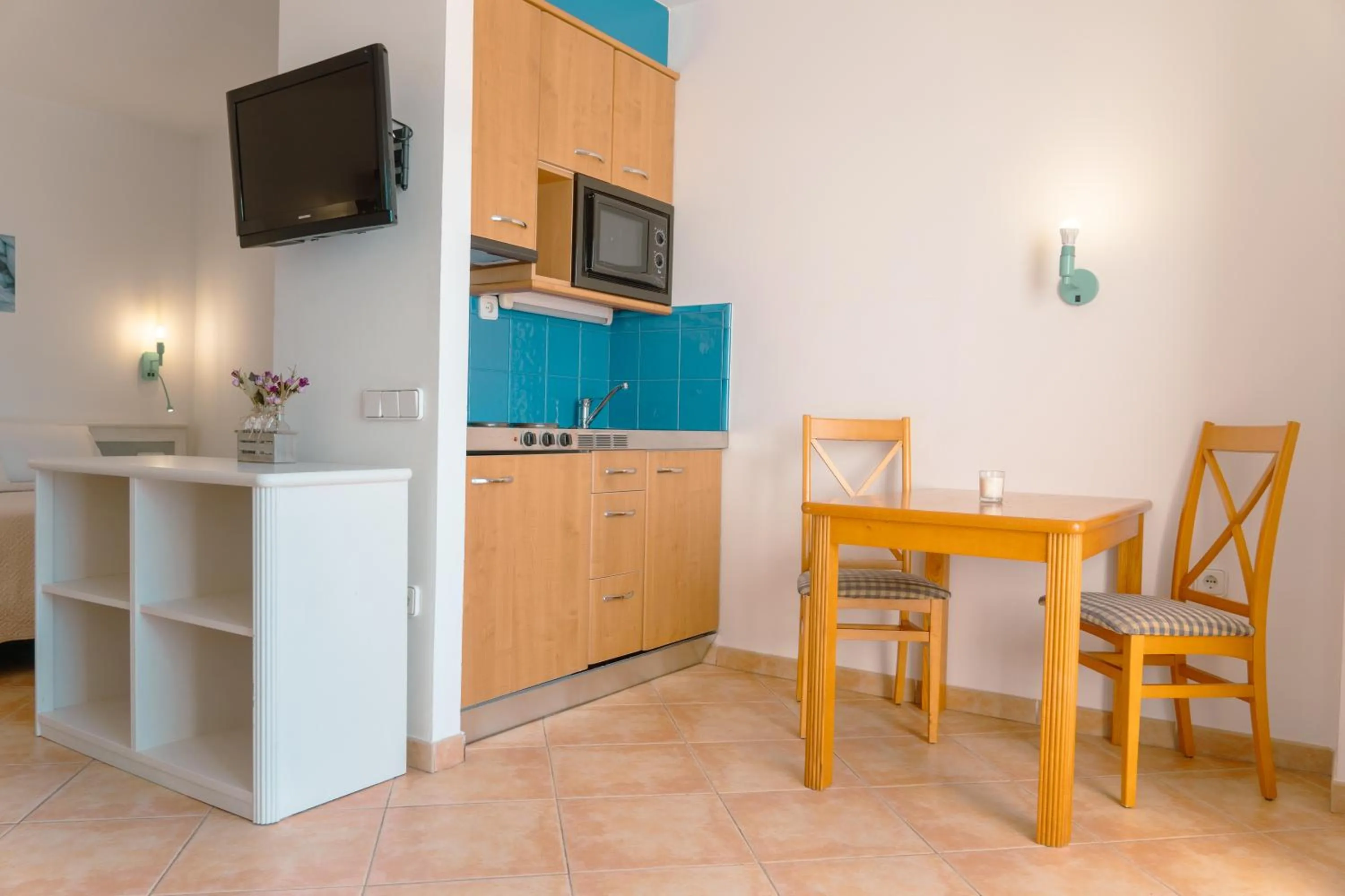 Kitchen or kitchenette in Rosamar Ibiza Hotel