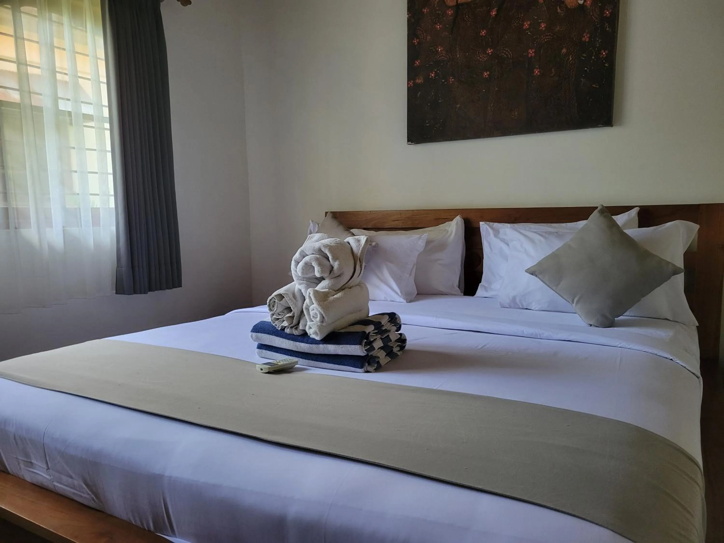 Bed in Kusnadi Hotel